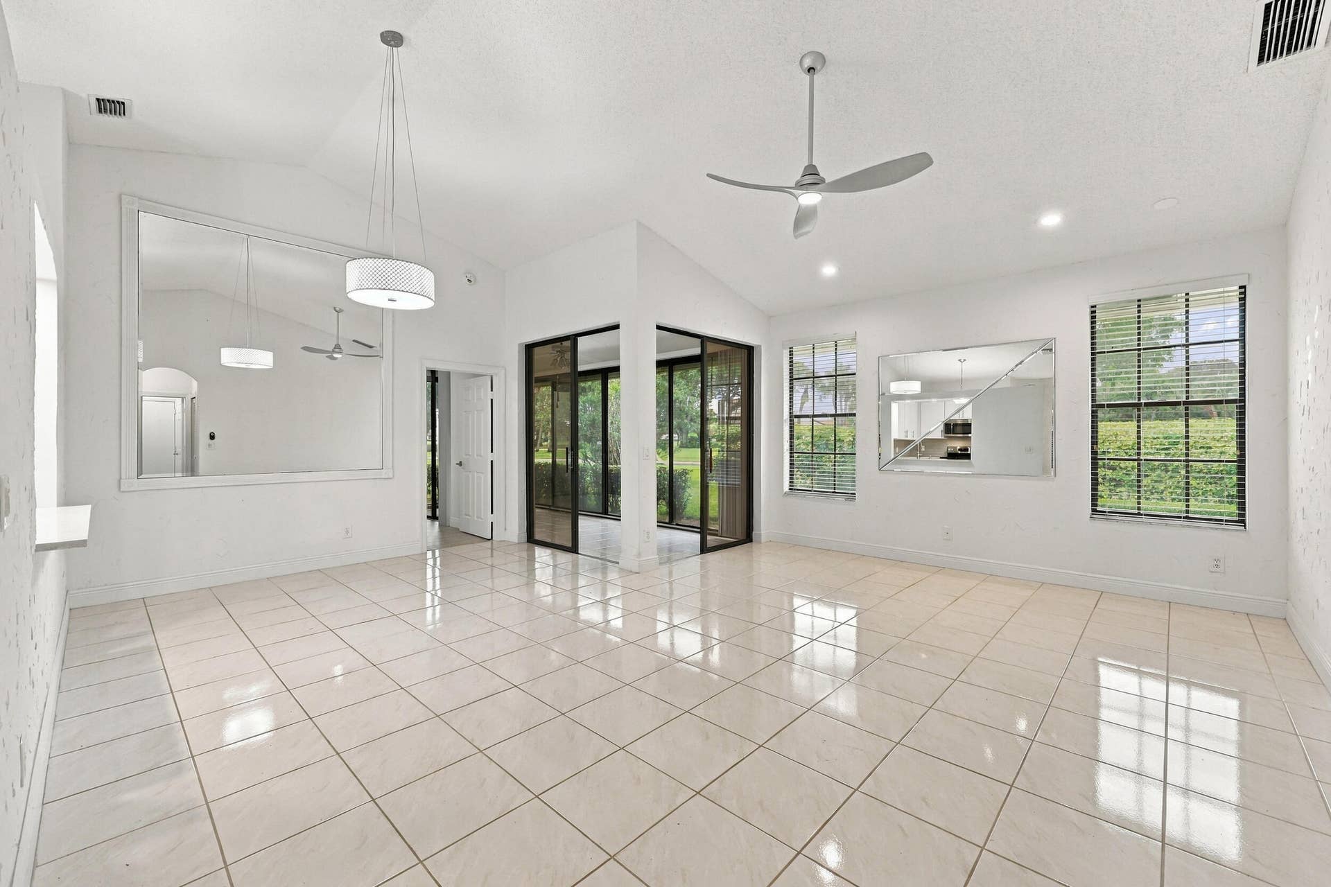 8292 WATERLINE Drive, #106, Boynton Beach, FL 33472 Vaulted ceilings, recessed lighting, and tile flooring