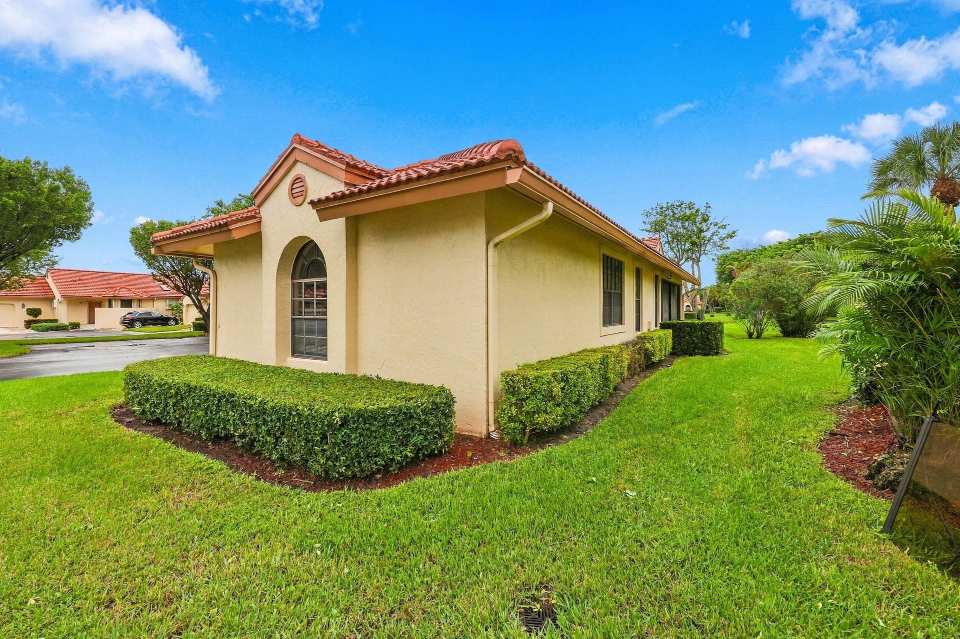 8292 Waterline Drive, #106, Boynton Beach, FL 33472 Stucco exterior with a terracotta tile roof
