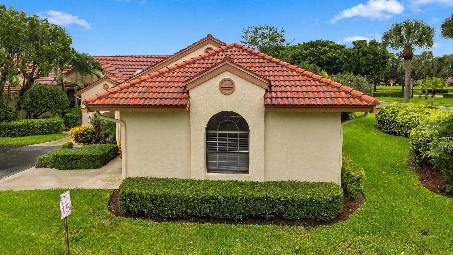 8292 Waterline Drive, #106, Boynton Beach, FL 33472 Mediterranean-style architecture featuring a terracotta tile roof