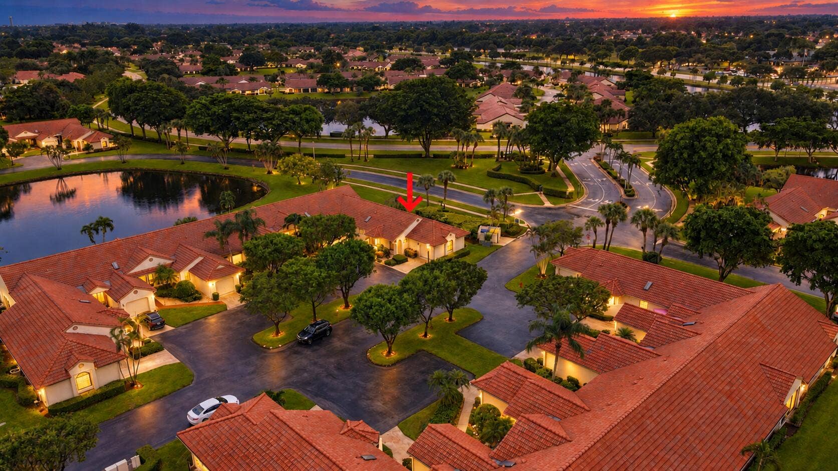 8292 Waterline Drive, #106, Boynton Beach, FL 33472 Aerial perspective of a community featuring terracotta-style roofing and lush, mature landscaping