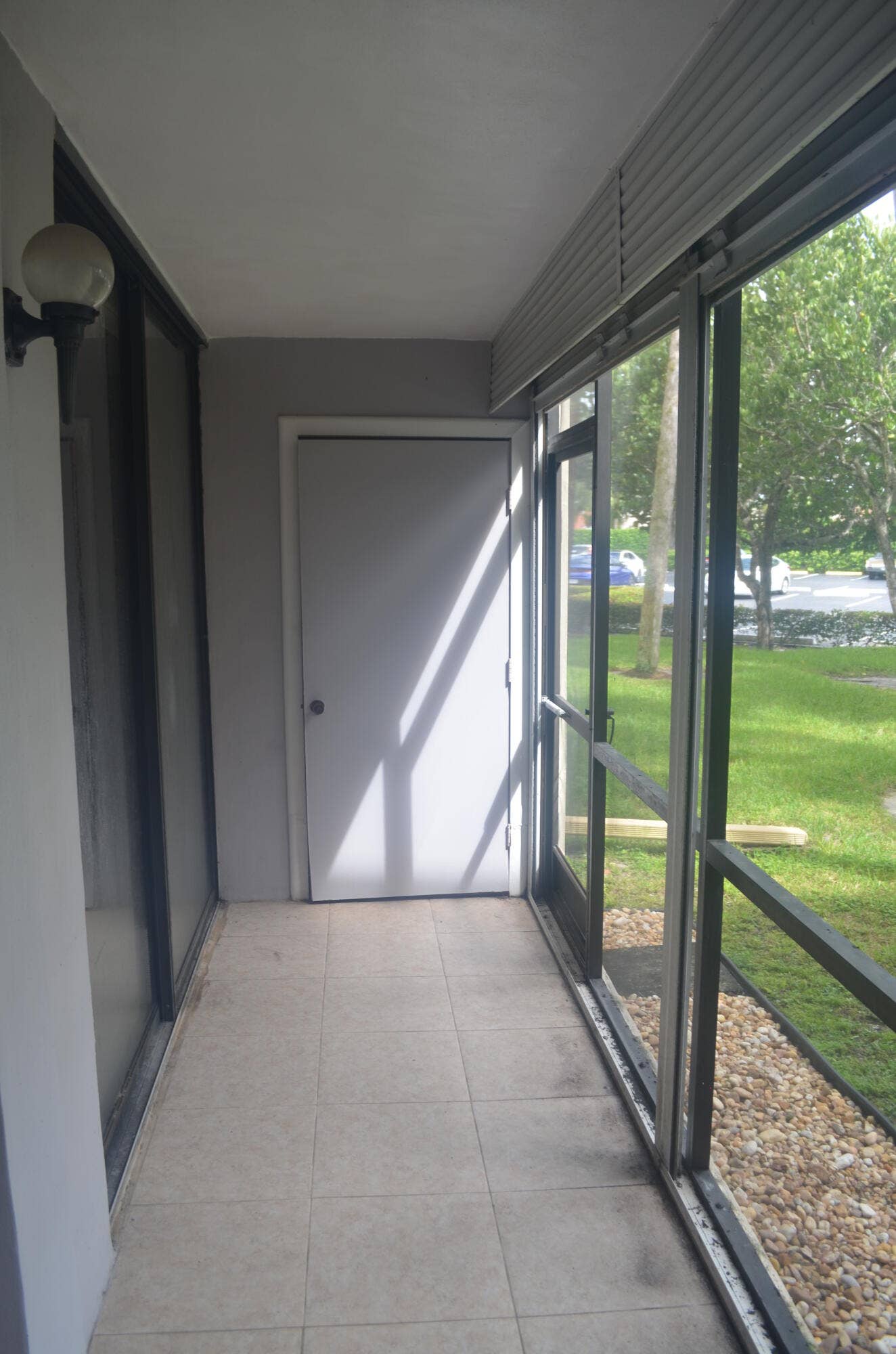5130 Las Verdes Circle, #121, Delray Beach, FL 33484 Screened Patio with Laundry Closet