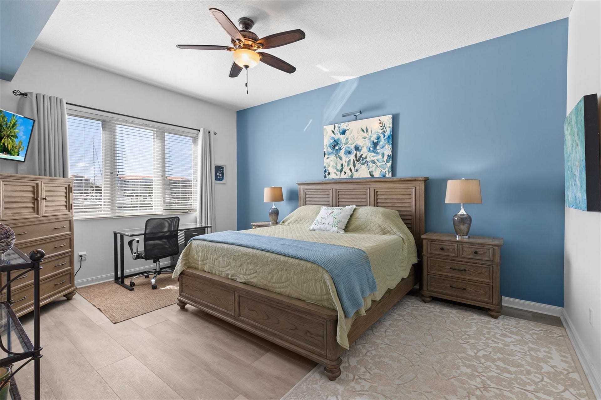 9 HARBOUR ISLE Drive E, #102, Fort Pierce, FL 34949 Primary Bedroom is spacious and overlooks the marina. It has an ensuite primary bath and two walk-in closets.