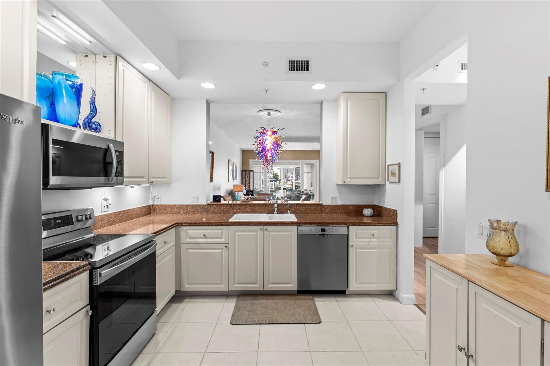 9 HARBOUR ISLE Drive E, #102, Fort Pierce, FL 34949 Open kitchen with stainless appliances