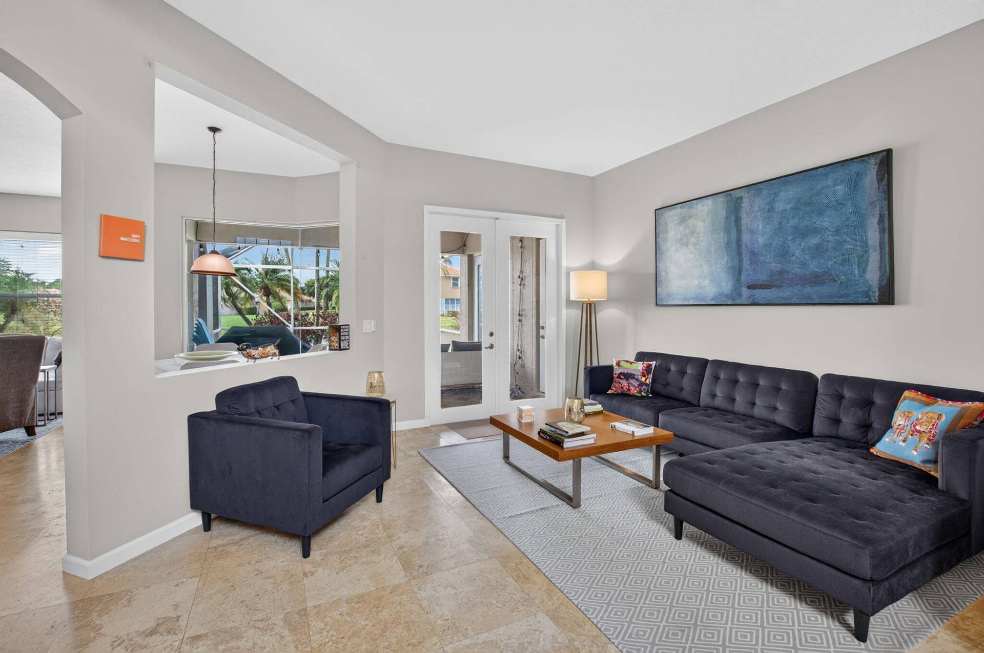 6610 Aston Lane, Boynton Beach, FL 33437 Neutral wall paint, recessed lighting, tile flooring, glass-paneled door, and a pass-through window