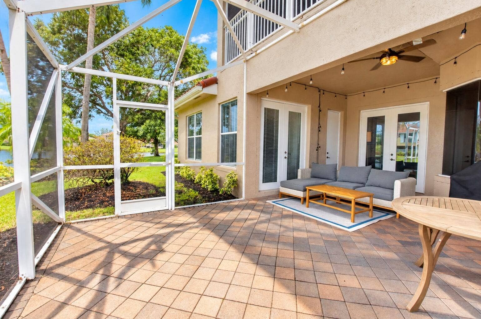 6610 Aston Lane, Boynton Beach, FL 33437 Screened lanai featuring paver flooring