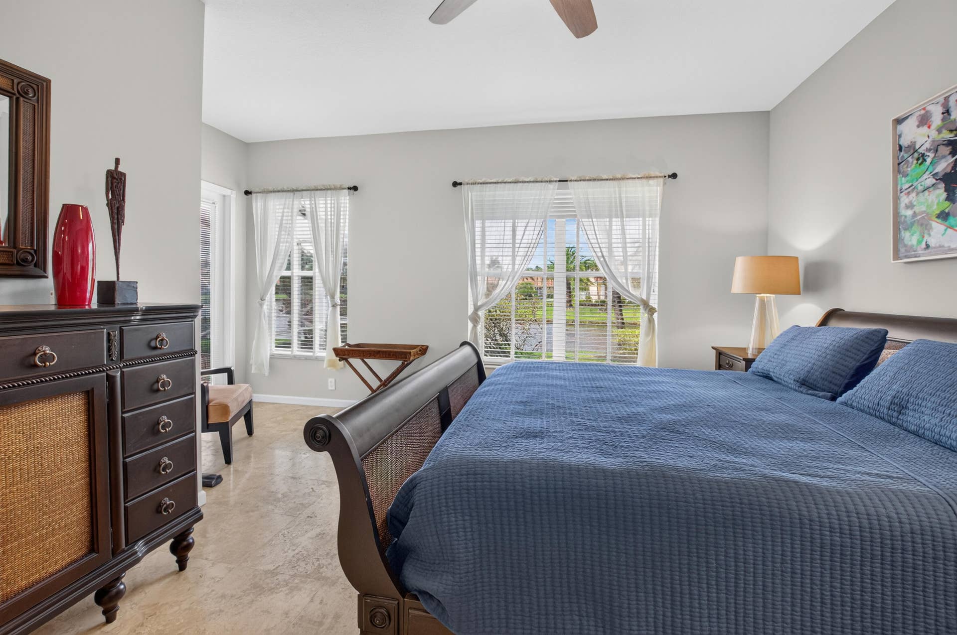 6610 Aston Lane, Boynton Beach, FL 33437 Recessed lighting, light-toned wall paint, two windows with white blinds, and a ceiling fan