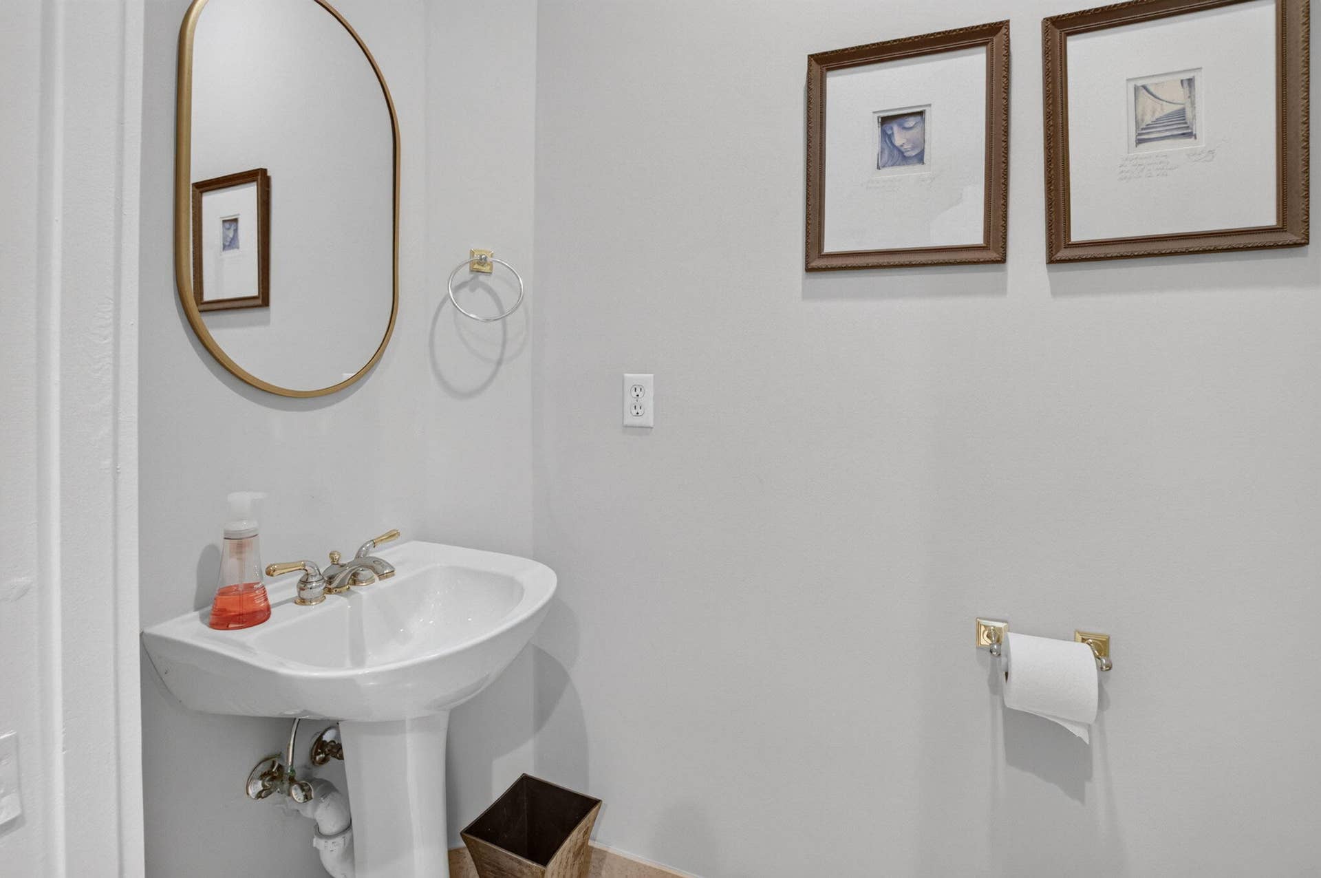6610 Aston Lane, Boynton Beach, FL 33437 Pedestal sink with brass-finish hardware and fixture