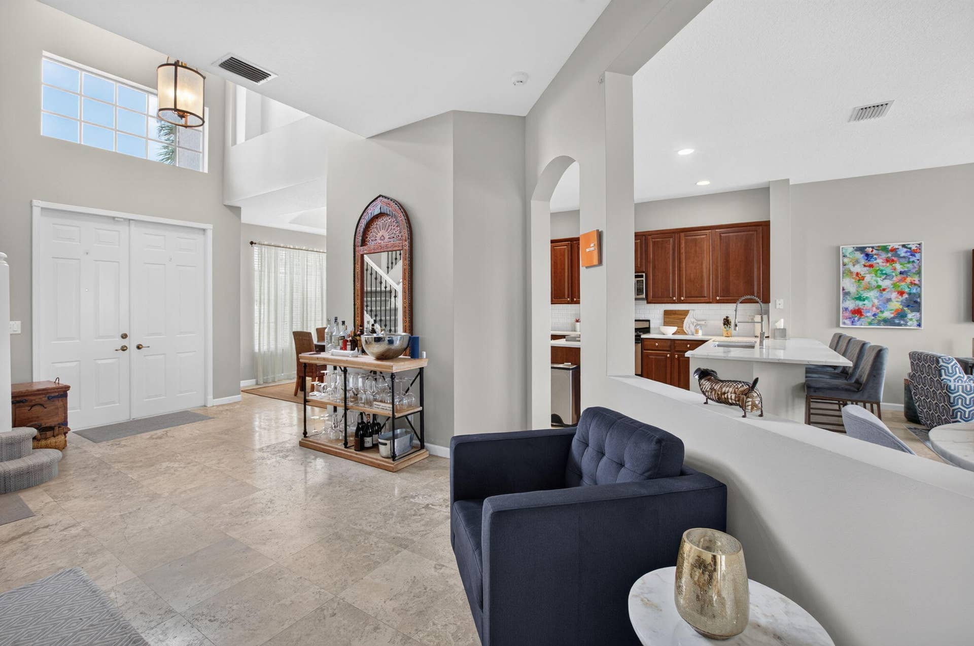 6610 Aston Lane, Boynton Beach, FL 33437 Double entry doors with transom window, vaulted ceiling, tile flooring, arched entryways, and recessed lighting