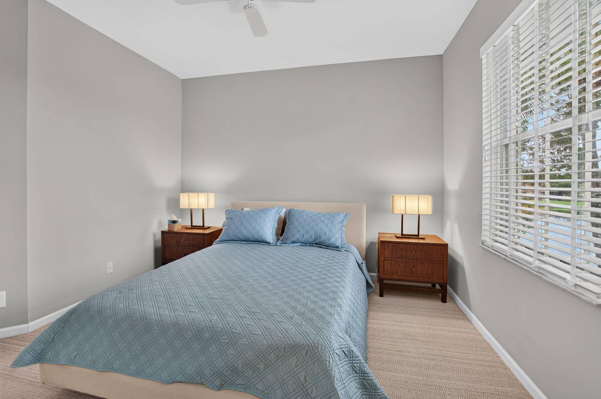 6610 Aston Lane, Boynton Beach, FL 33437 white ceiling fan, light gray wall paint, and a large window with white blinds