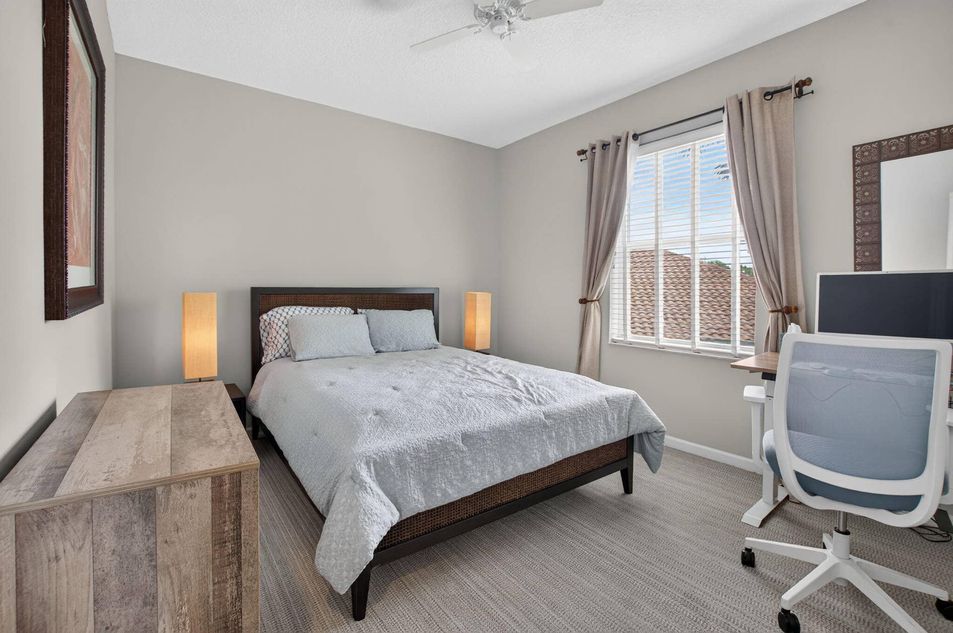 6610 Aston Lane, Boynton Beach, FL 33437 Vaulted ceiling, light neutral wall color, window with blinds and drapes, ceiling fan, and grey patterned carpeting