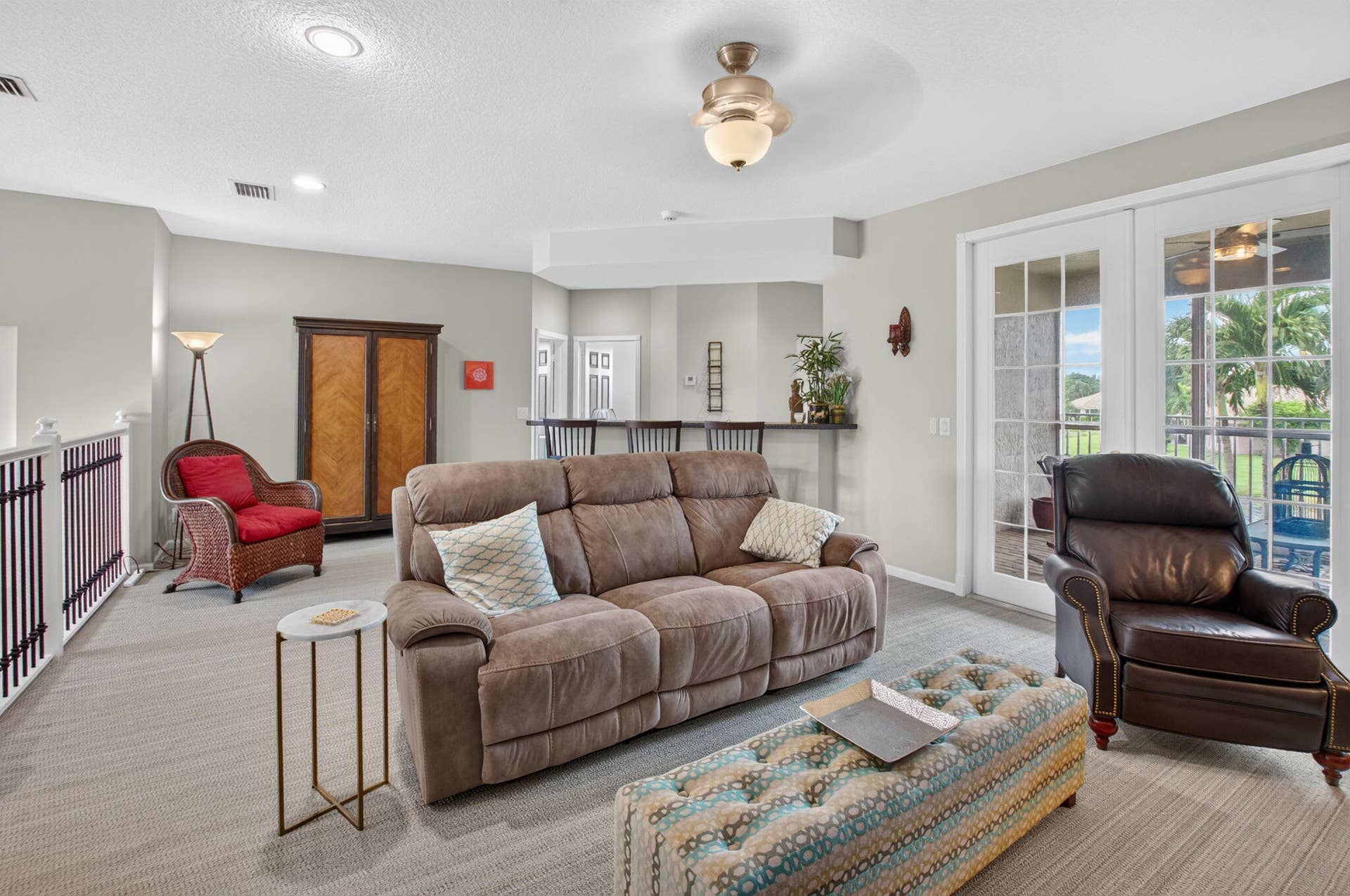 6610 Aston Lane, Boynton Beach, FL 33437 Recessed lighting, ceiling fan with integrated light, carpeted flooring, and a built-in bar area with seating
