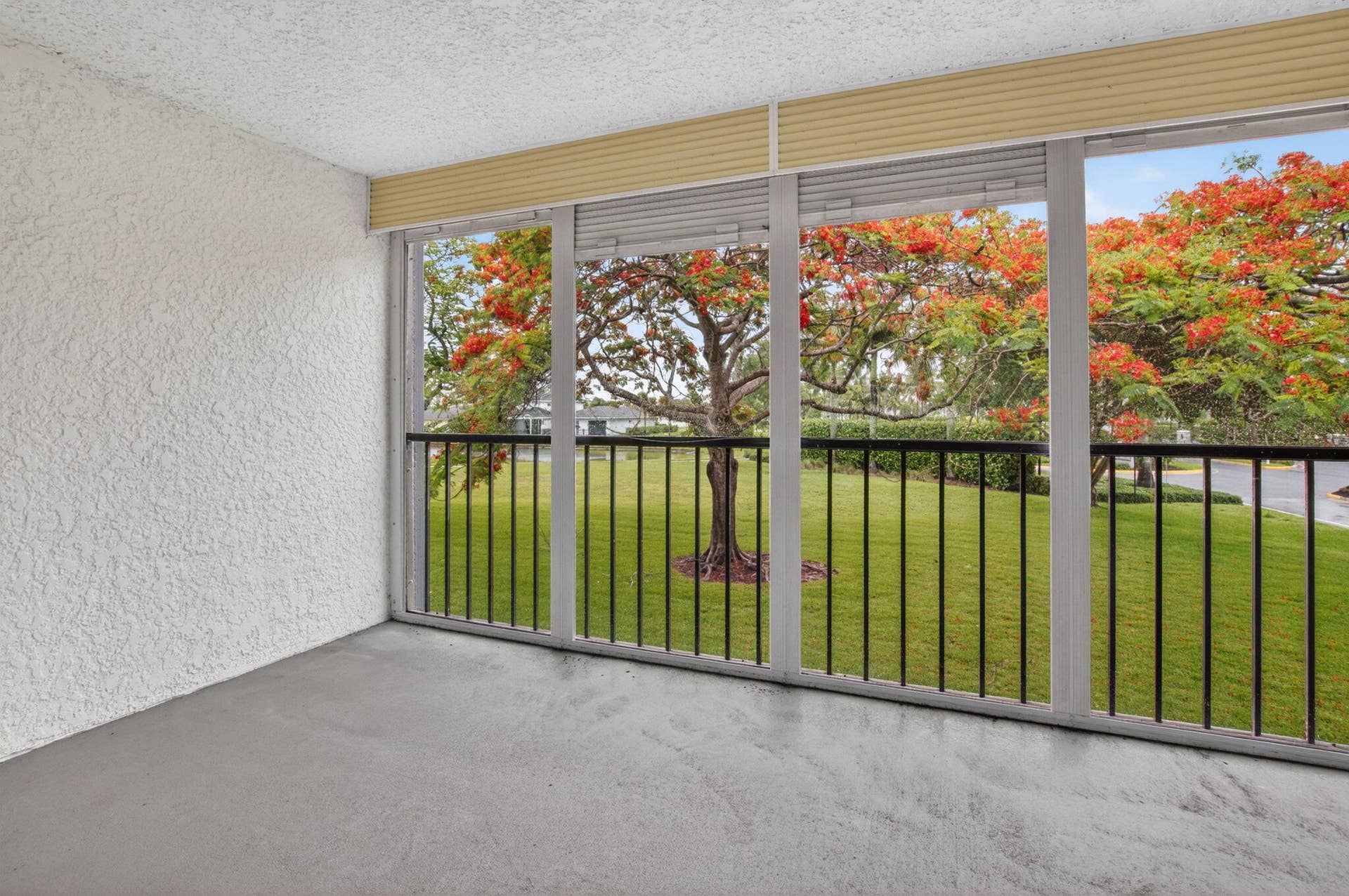 14701 Cumberland Drive, #2080, Delray Beach, FL 33446 Screened balcony overlooking late and lush green space