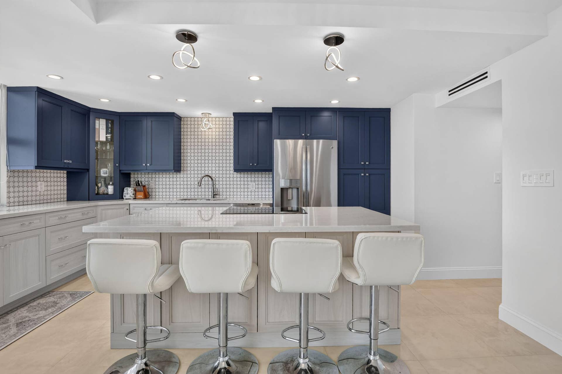 Island, soft close cabinets, pantry, decorator fixtures and endless views.