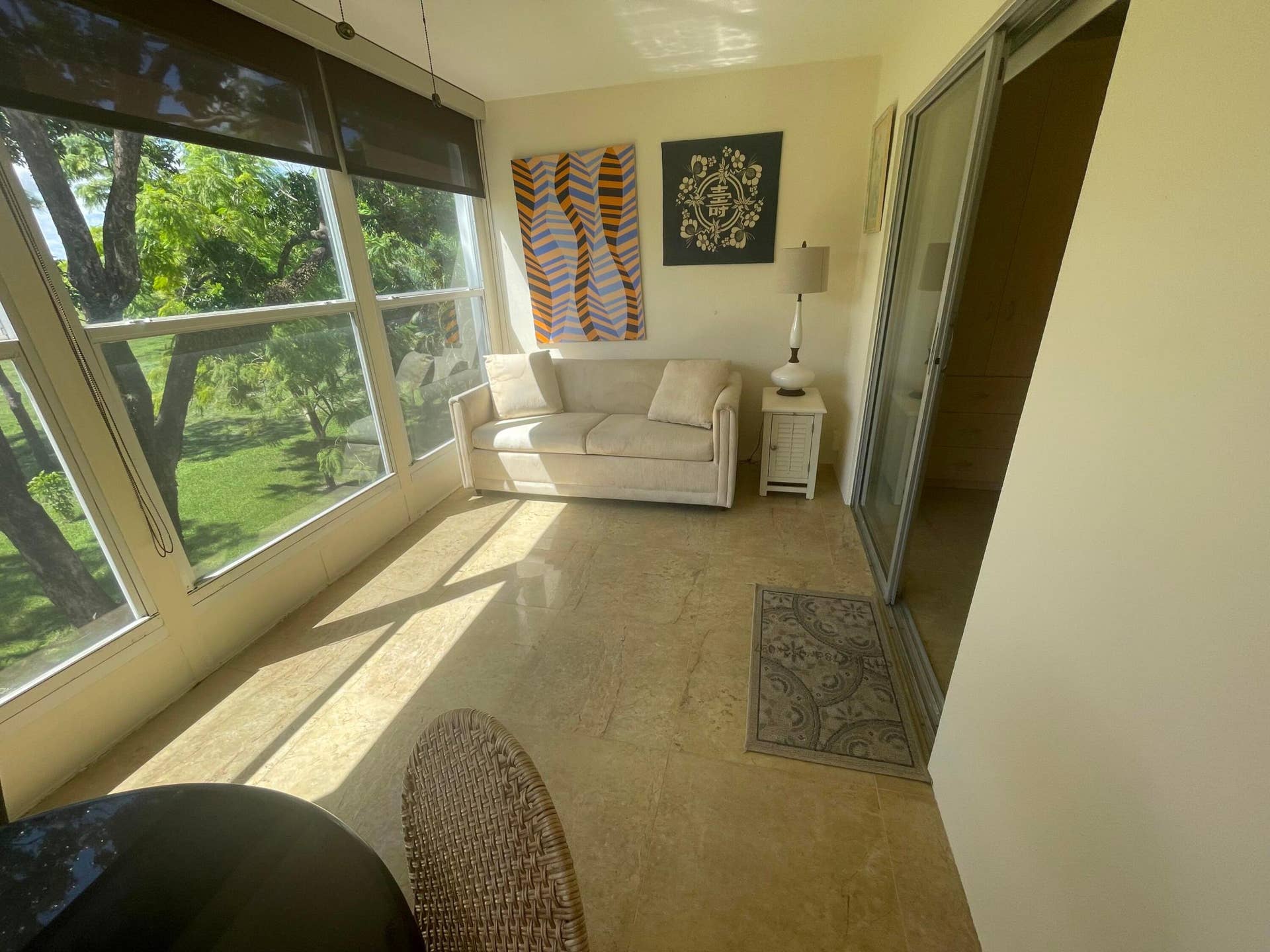 Tiled Enclosed Patio Overlooking Serene Garden Area