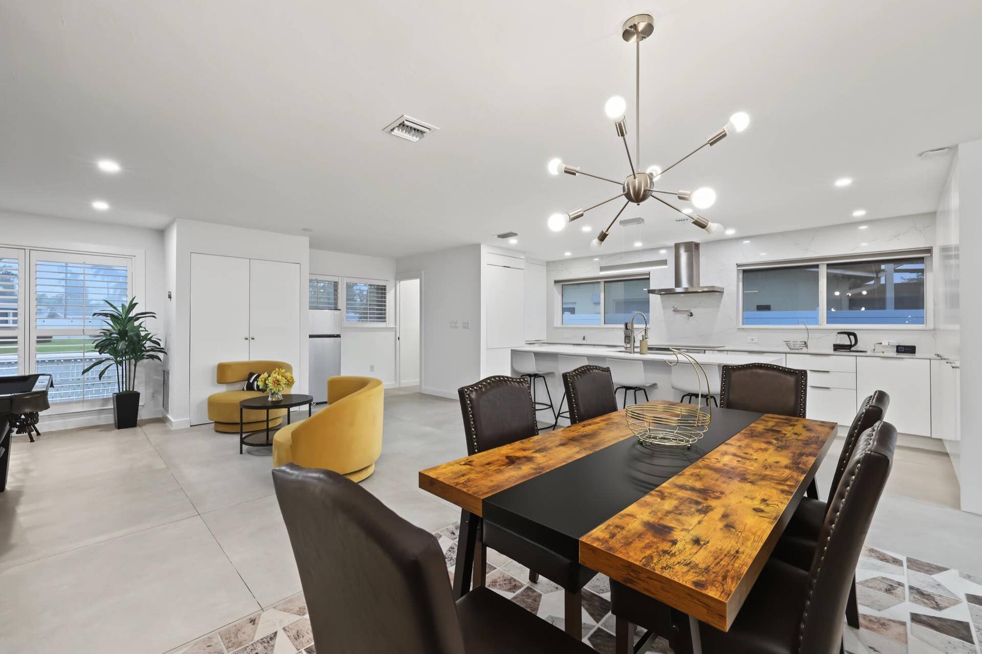 1311 SE 4TH Avenue, Pompano Beach, Pompano Beach, FL 33060 Open-concept living space with recessed lighting and a modern chandelier