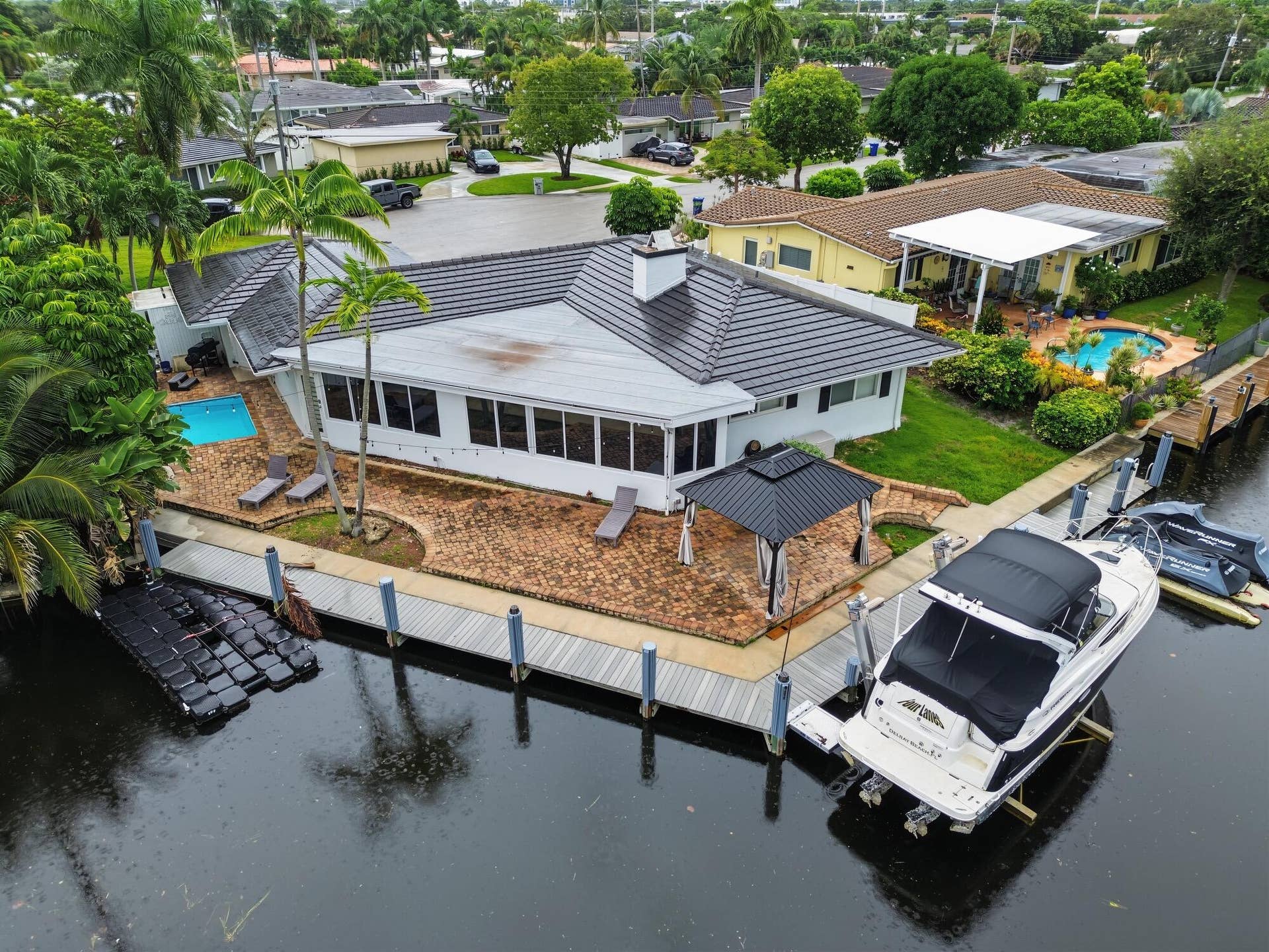 1311 SE 4TH Avenue, Pompano Beach, Pompano Beach, FL 33060 Waterfront property featuring a private boat lift, a dock, and a swimming pool