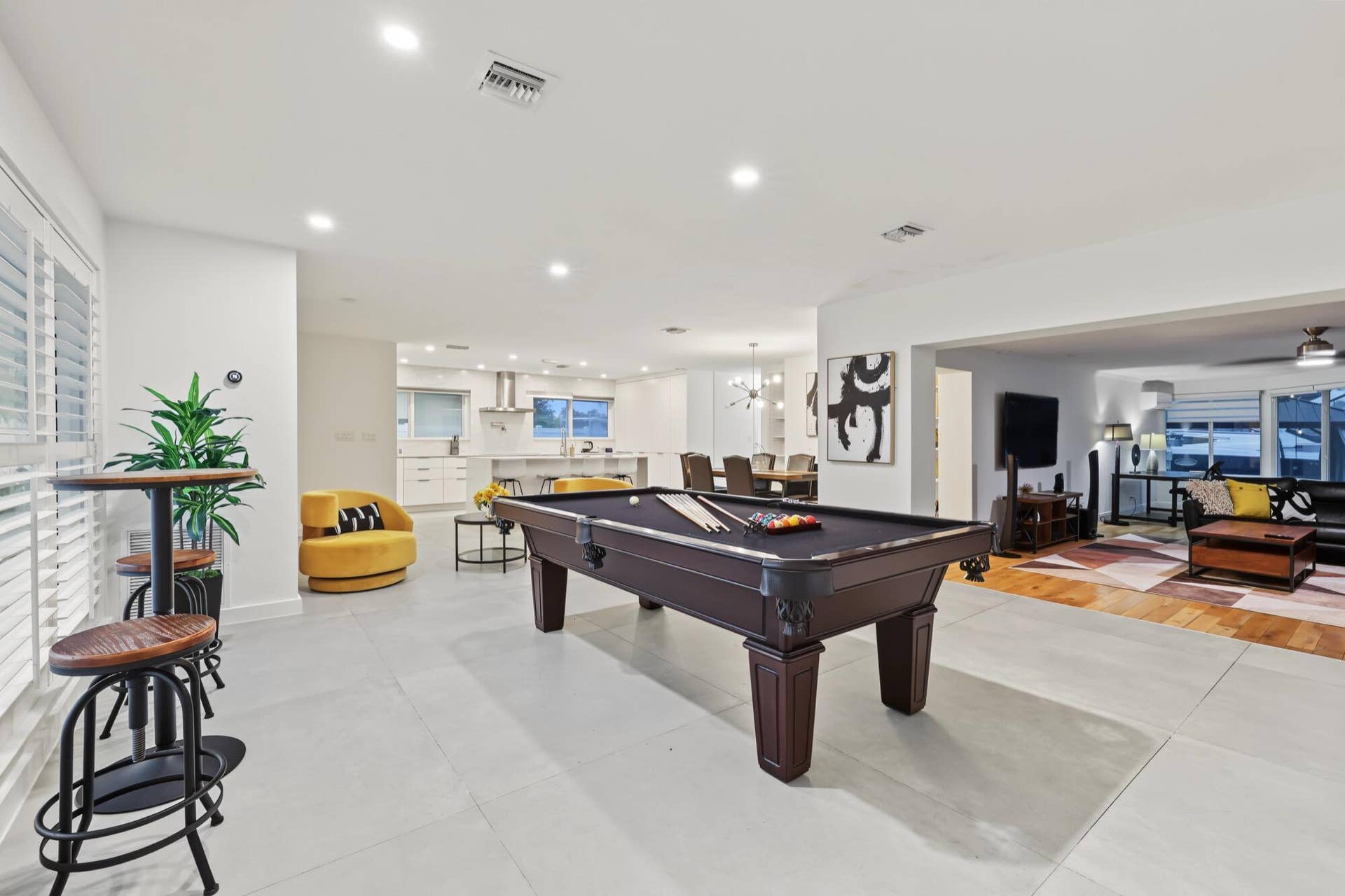 1311 SE 4TH Avenue, Pompano Beach, Pompano Beach, FL 33060 Spacious interior featuring a built-in pool table, recessed lighting, plantation shutters, and light-toned tile flooring