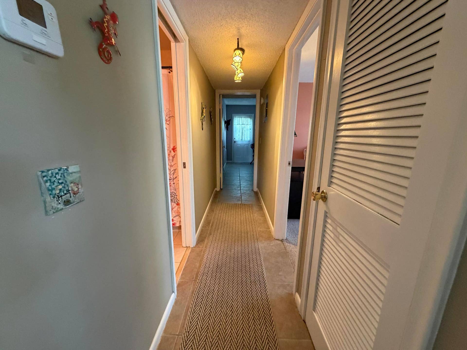 Main Interior Hallway to the bedrooms & baths and the open air back patio...