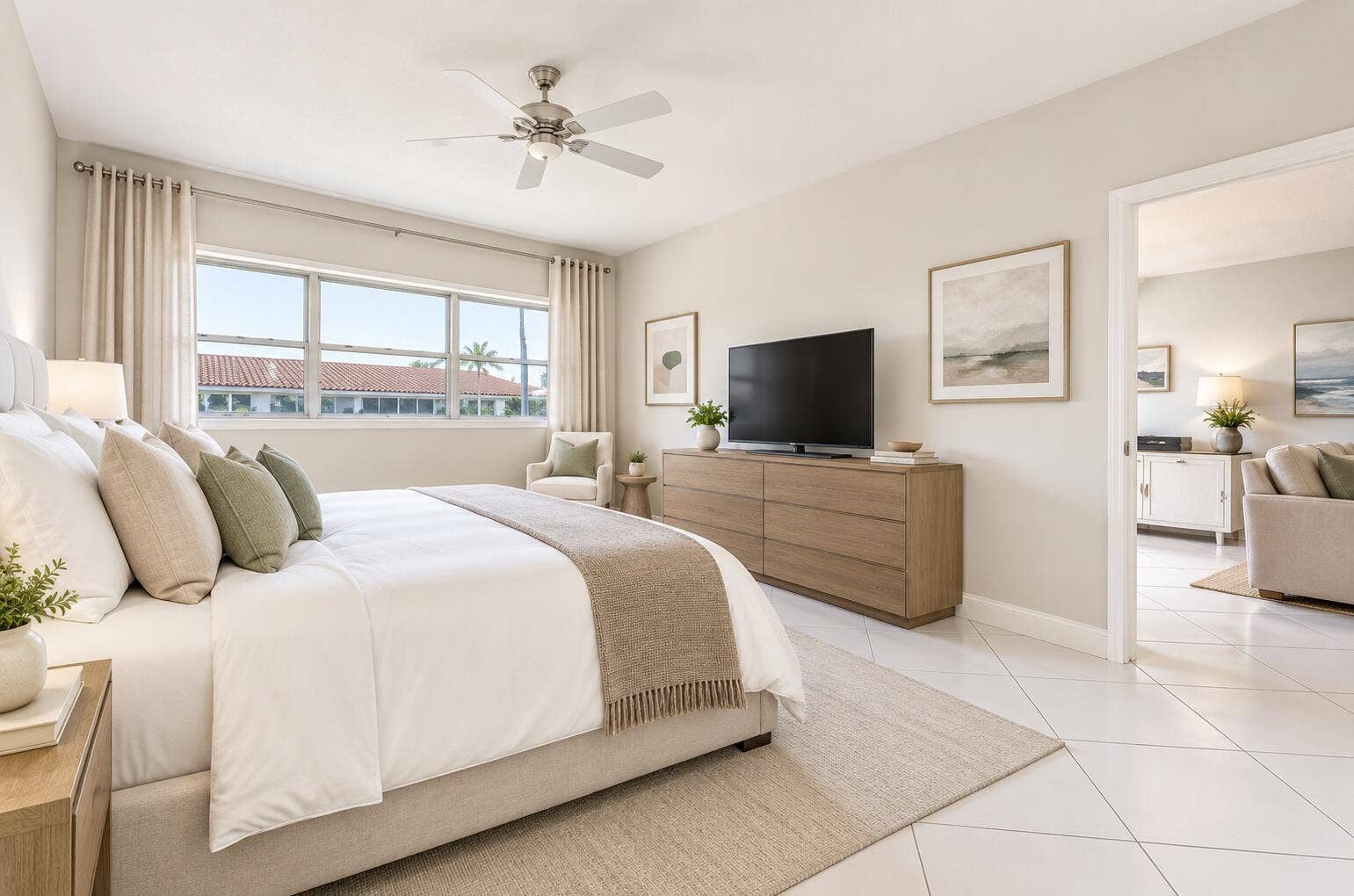 Recessed lighting, ceiling fan, expansive window, wood-finish dresser, and white tile flooring