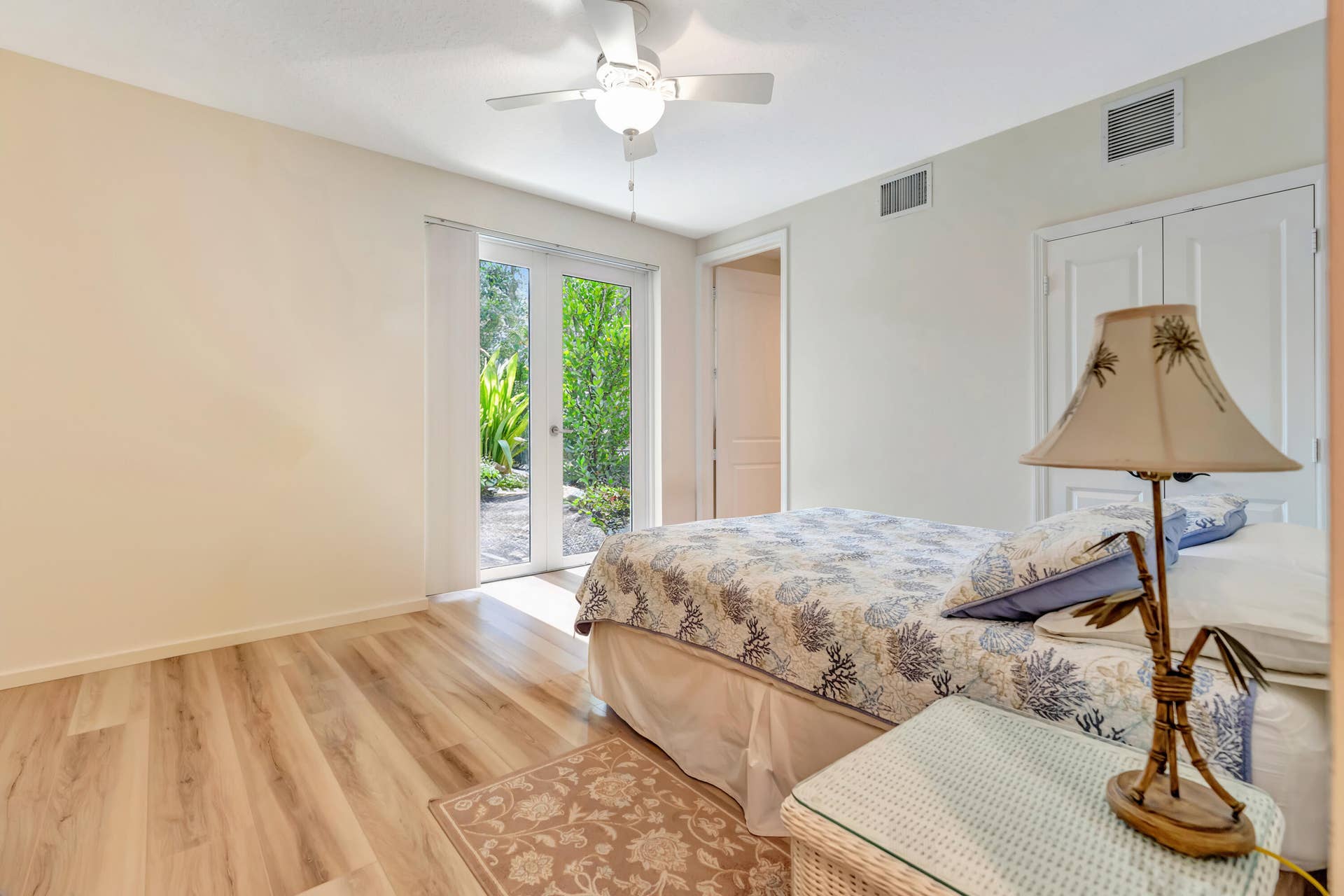 471 JUNO DUNES Way, Juno Beach, FL 33408 Wood-finish flooring throughout, white double French doors, and built-in double closets