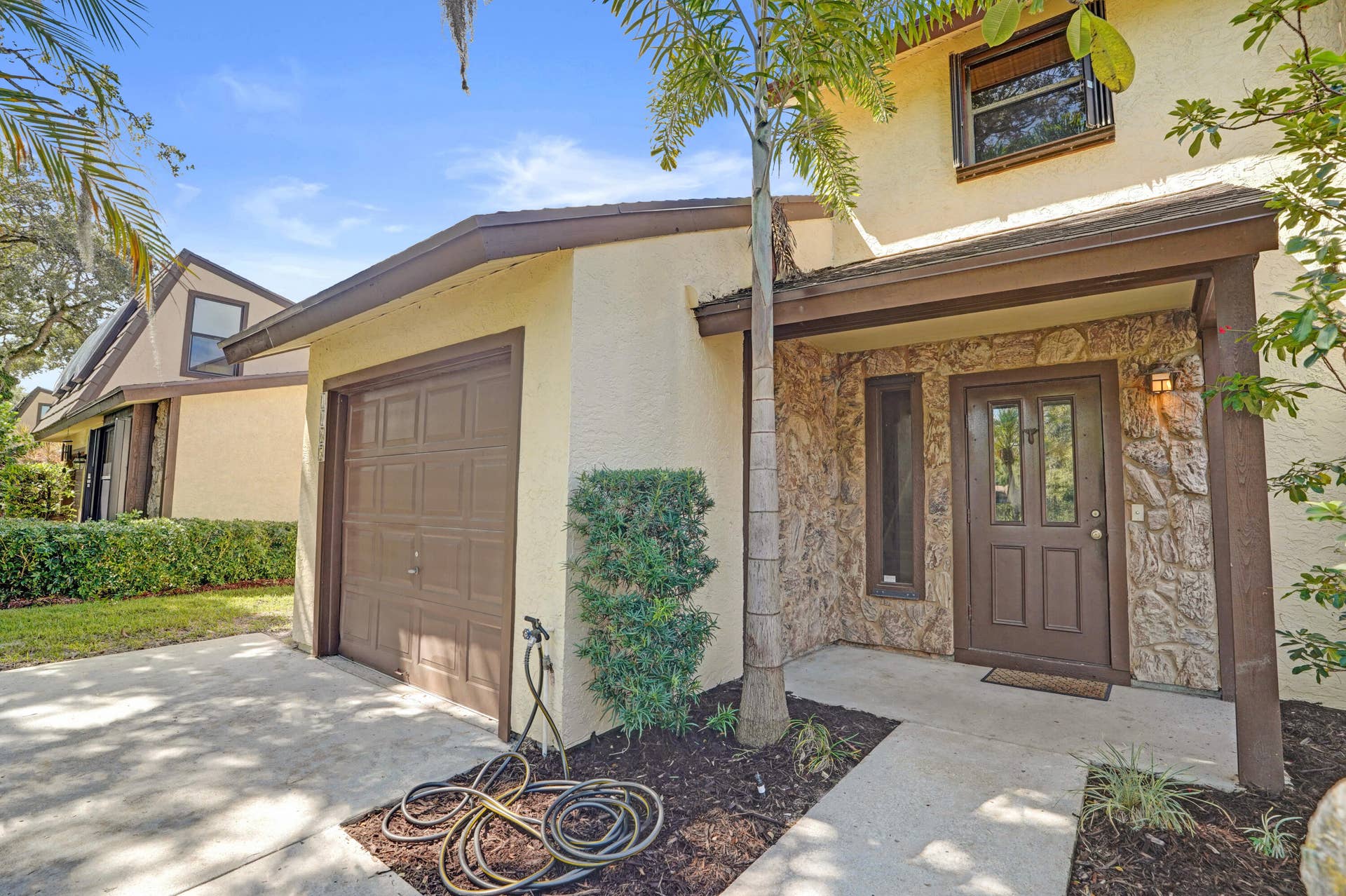 Front view exterior freshly landscaped with new roof.