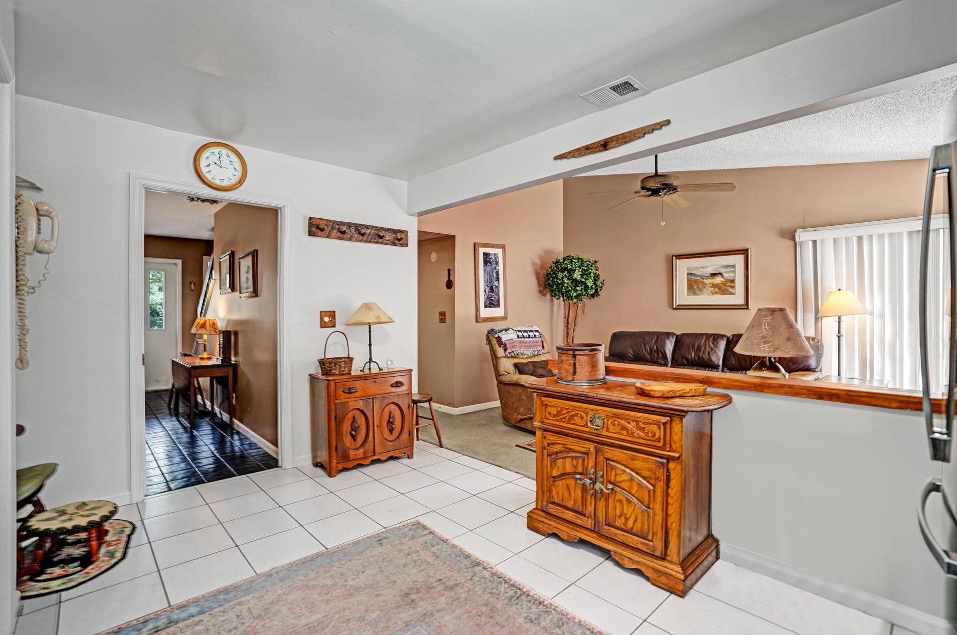 View from kitchen with hall that leads to front and open to familly room.