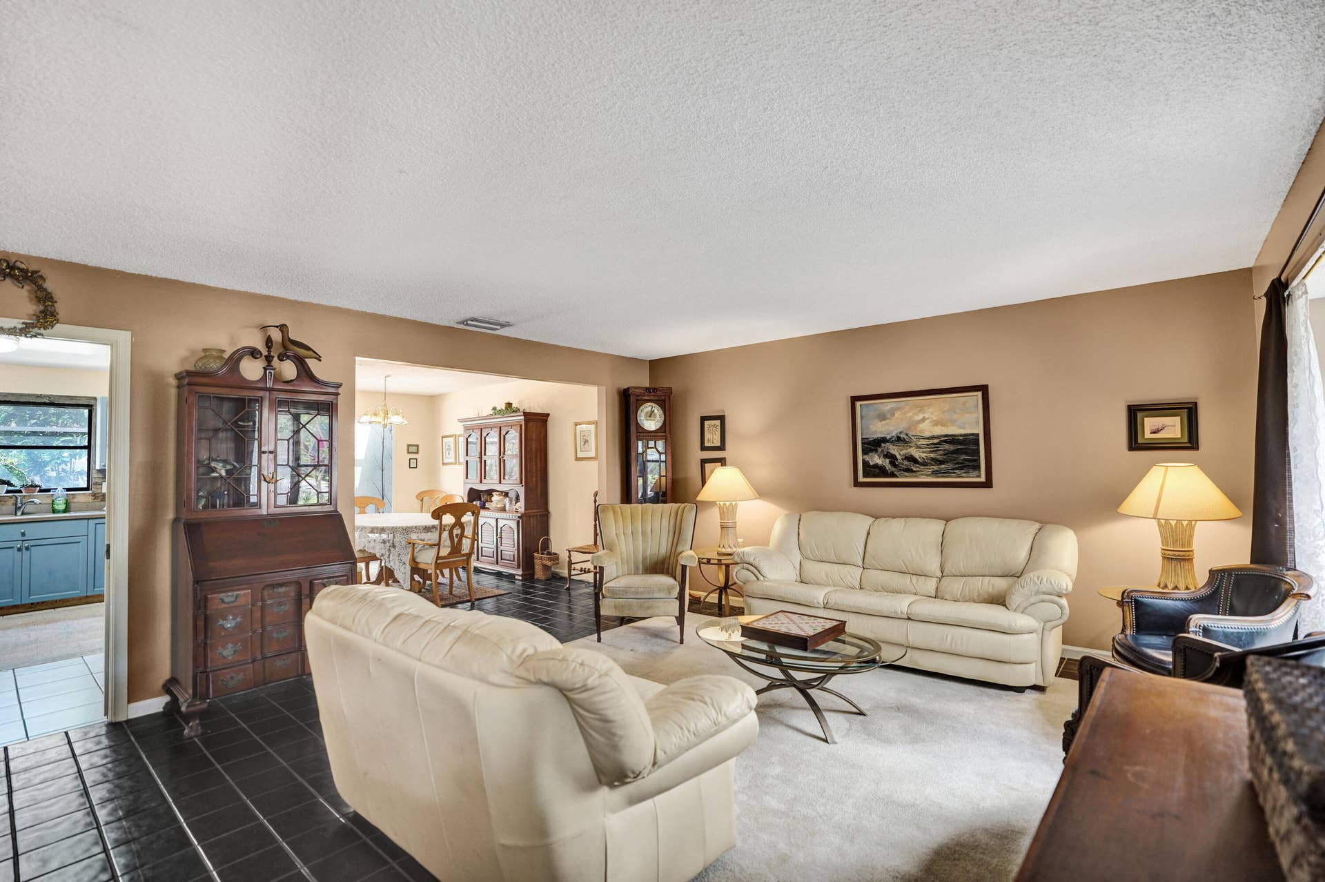 View from front entry leads to living room, dining room and kitchen.