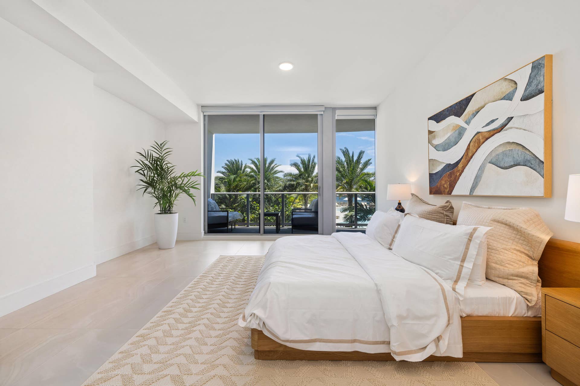 220 Lake Shore Drive, #704, Lake Park, FL 33403 Recessed lighting throughout, floor-to-ceiling sliding glass doors, balcony access, and light-toned tile flooring