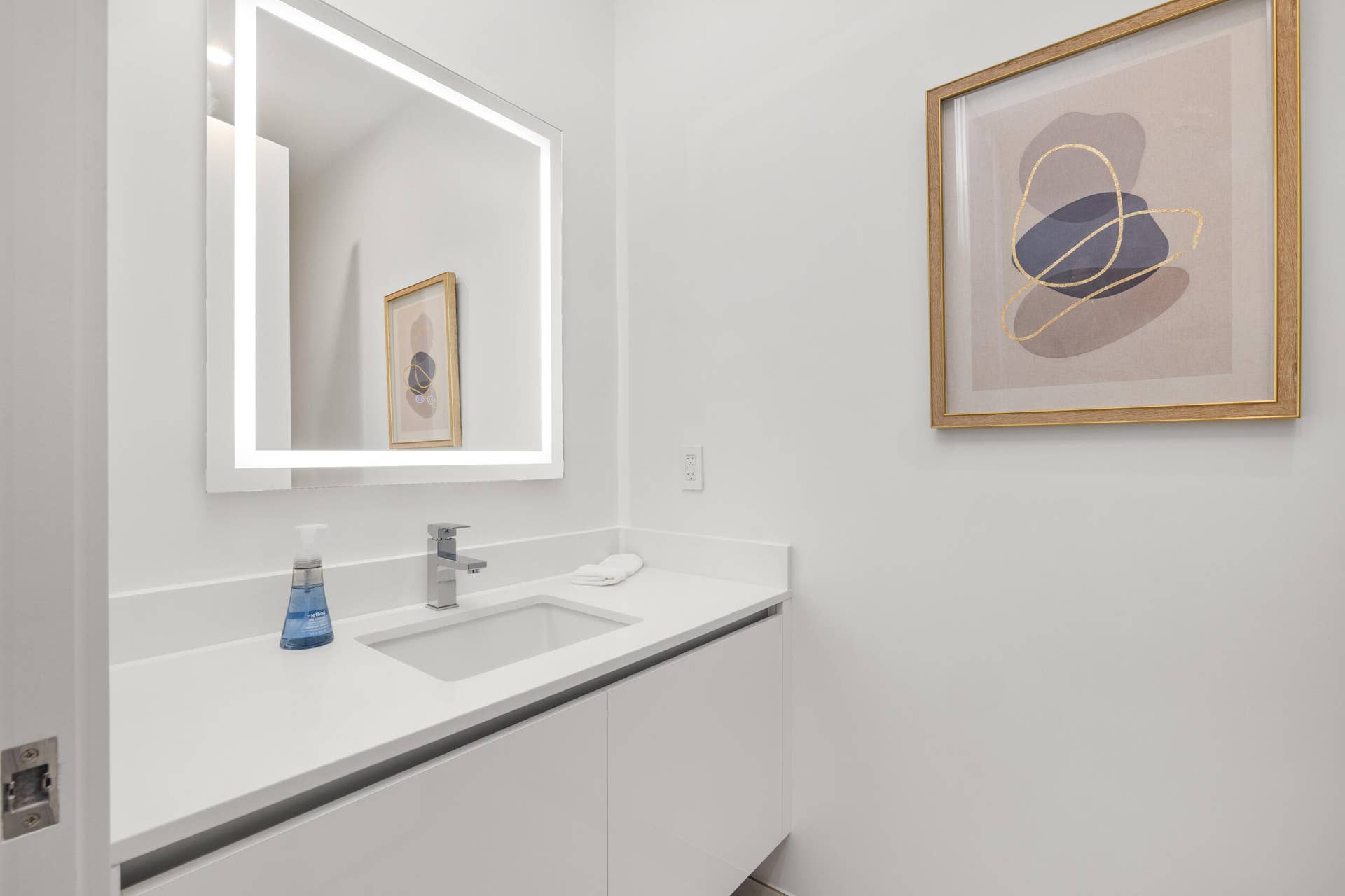 220 Lake Shore Drive, #704, Lake Park, FL 33403 Half Bath - Integrated vanity with a rectangular undermount sink, chrome faucet, and white countertop