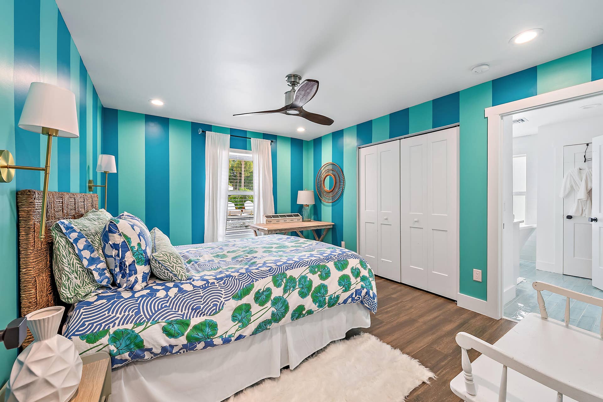 6204 SAND PINE Court, Jupiter, Jupiter, FL 33458 Wood-finish flooring with a ceiling fan