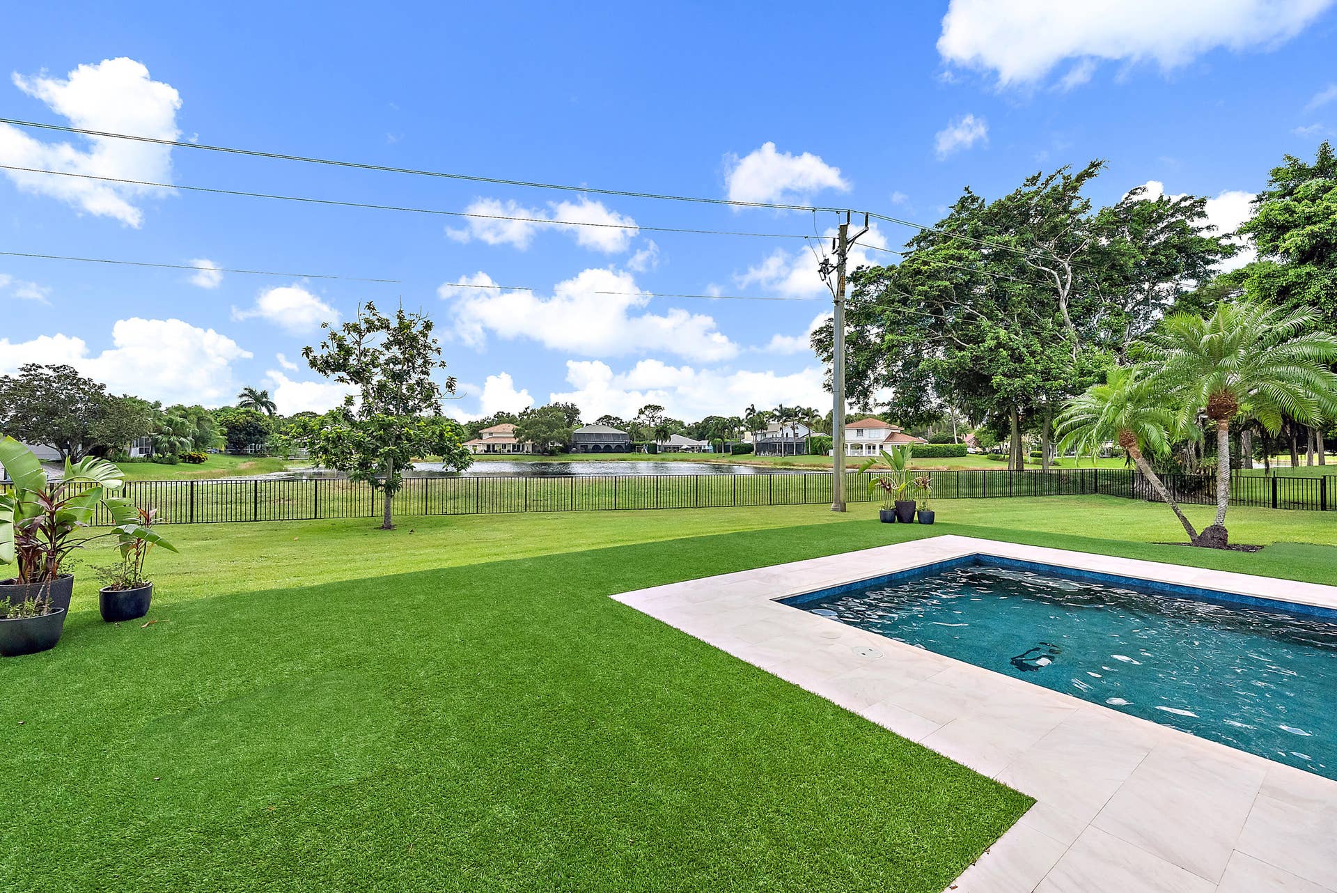 6204 SAND PINE Court, Jupiter, Jupiter, FL 33458 Swimming pool with a light-colored paved surround