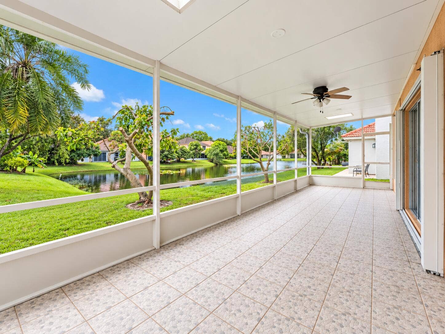 1045 Aspri Way, Riviera Beach, FL 33418 Screen Enclosure Lanai with Lake views