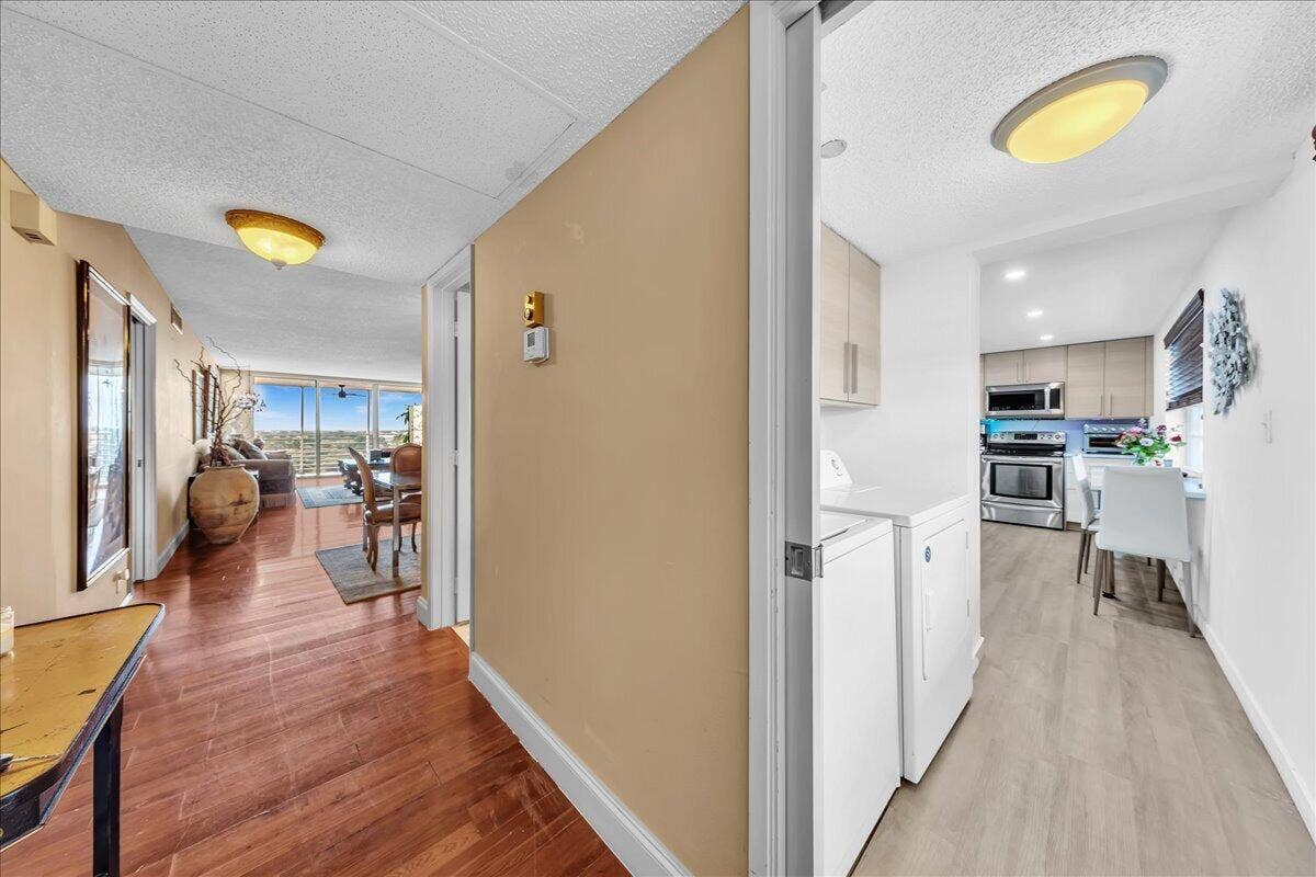 3520 Oaks Way, #904, Pompano Beach, FL 33069 Foyer view of side by side laundry