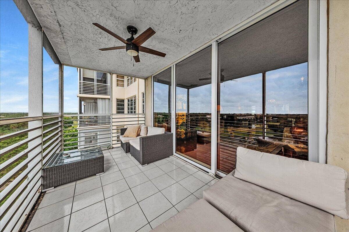 3520 Oaks Way, #904, Pompano Beach, FL 33069 Screened balcony with fan