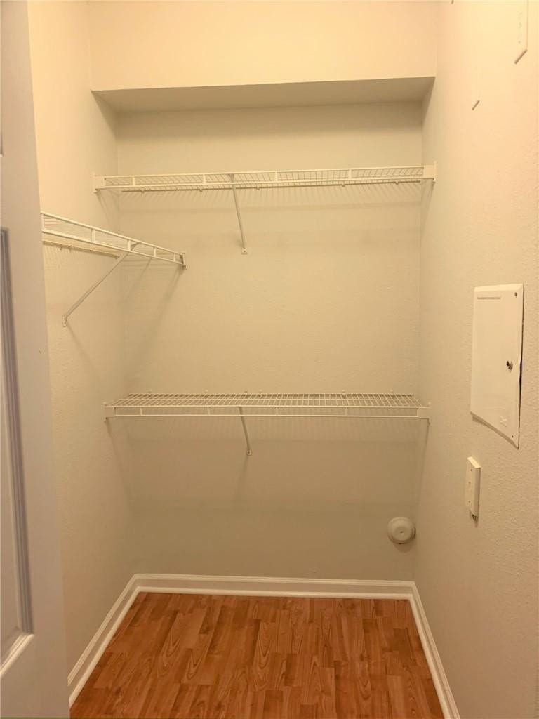 533 NE 3RD Avenue, #115, Fort Lauderdale, Fort Lauderdale, FL 33301 Storage closet featuring wire shelving, wood-finish flooring, and white trim