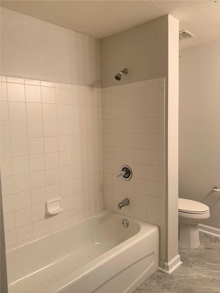 533 NE 3RD Avenue, #115, Fort Lauderdale, Fort Lauderdale, FL 33301 Tiled bath and shower combination with chrome fixtures, and grey-toned flooring