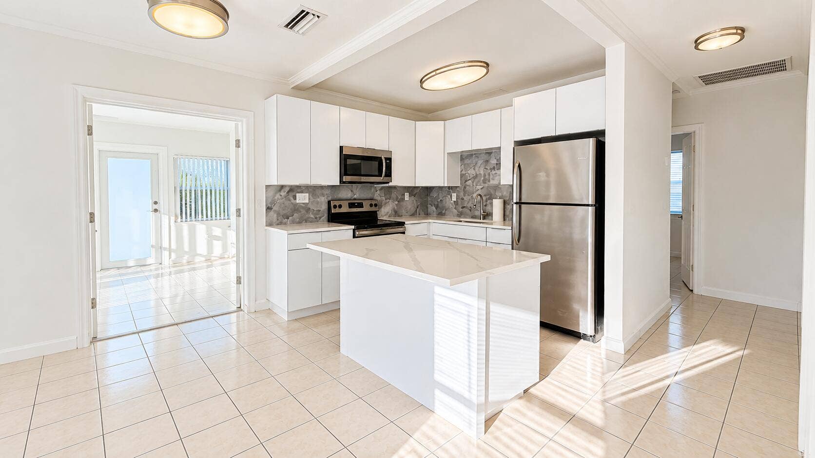 835 FERNWOOD Drive, West Palm Beach, West Palm Beach, FL 33405 Bright Modern Kitchen with Sunlit Island