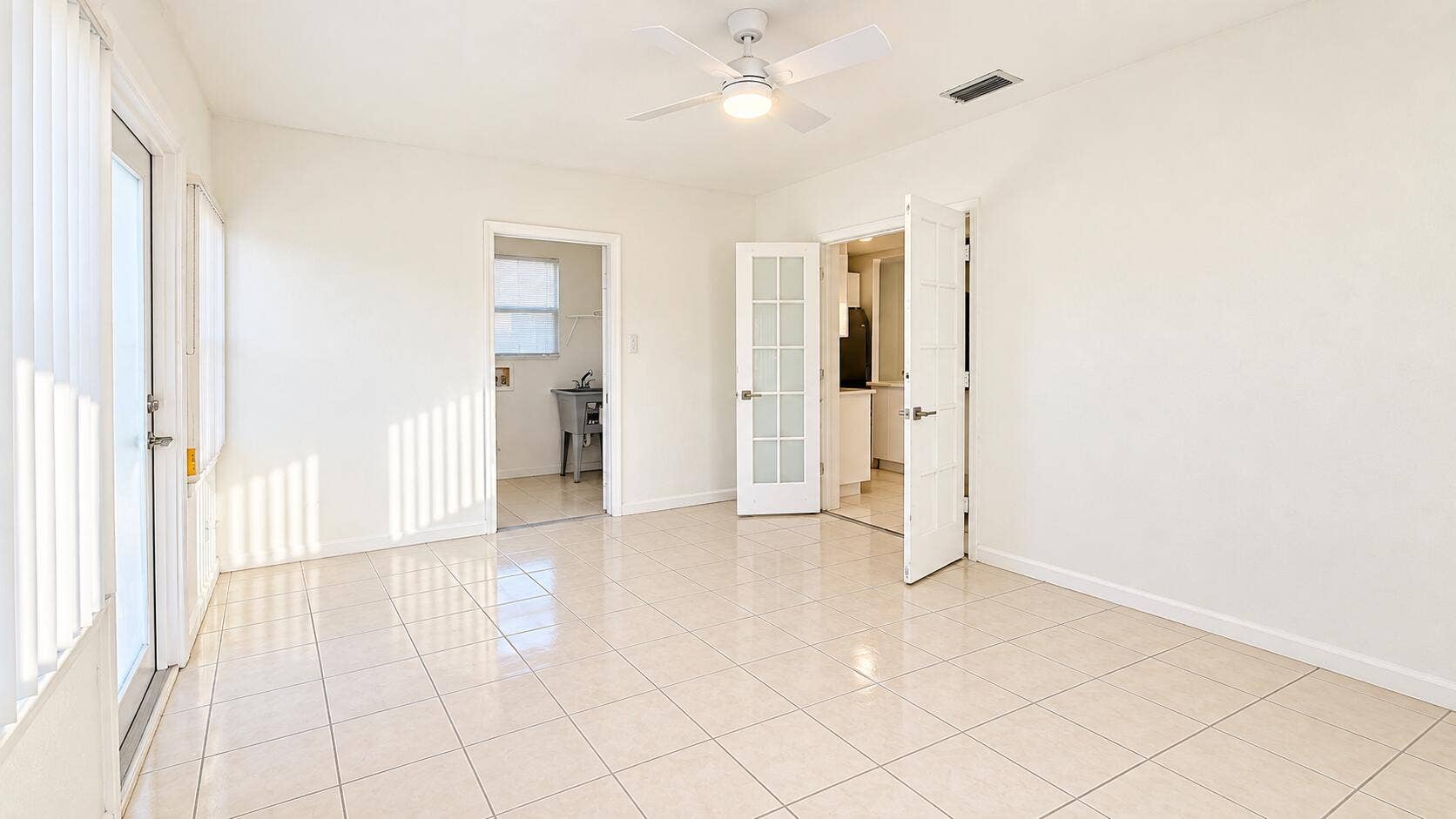 835 FERNWOOD Drive, West Palm Beach, West Palm Beach, FL 33405 Bright Neutral Room with Open Doorways