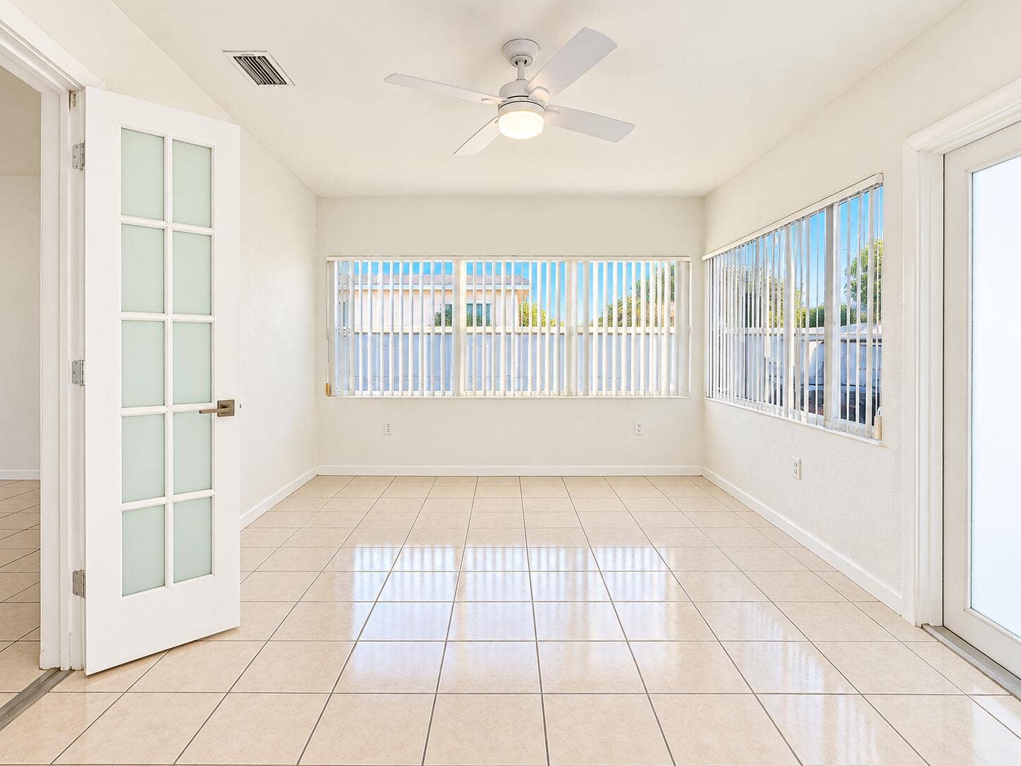 835 FERNWOOD Drive, West Palm Beach, West Palm Beach, FL 33405 Sunlit Minimalist Room with Blinds