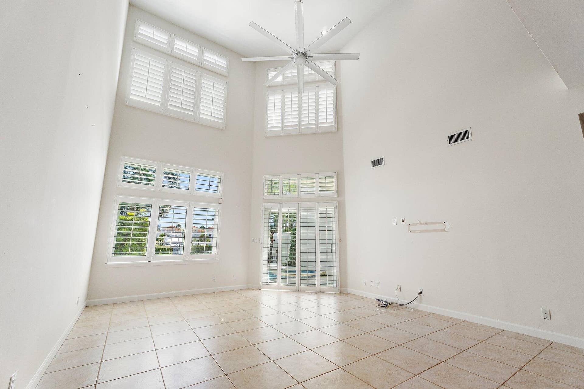 1412 HARBOUR POINT Drive, North Palm Beach, FL 33410 Double Height Living Room + Windows