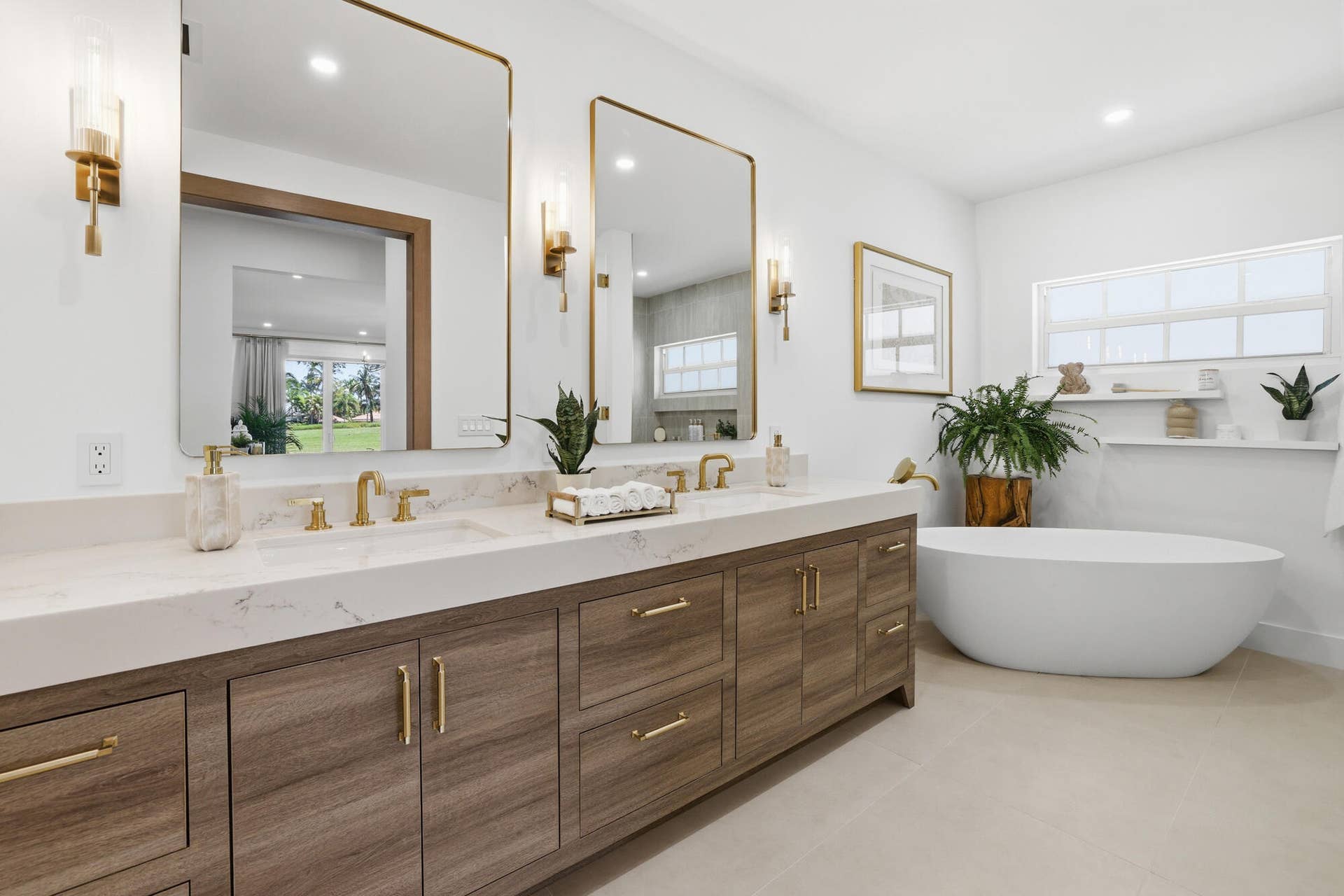 Primary bathroom with custom dual sink vanity and free standing tub