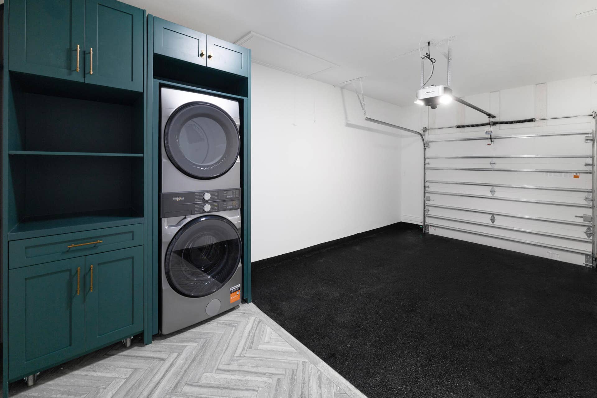 Custom built laundry with movable storage and professionally finished garage floor