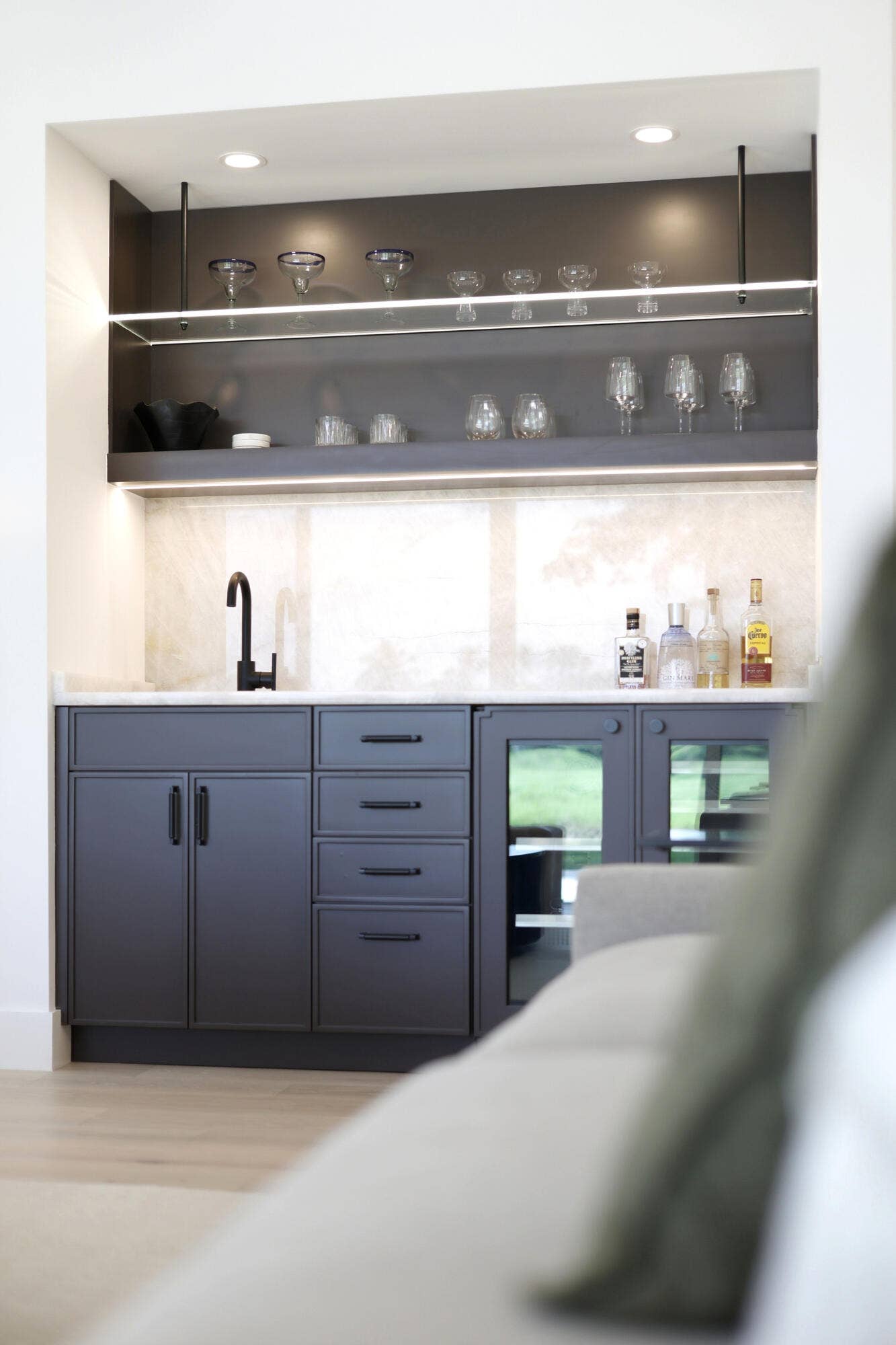 Wet Bar with wine fridge and storage and custom lighting