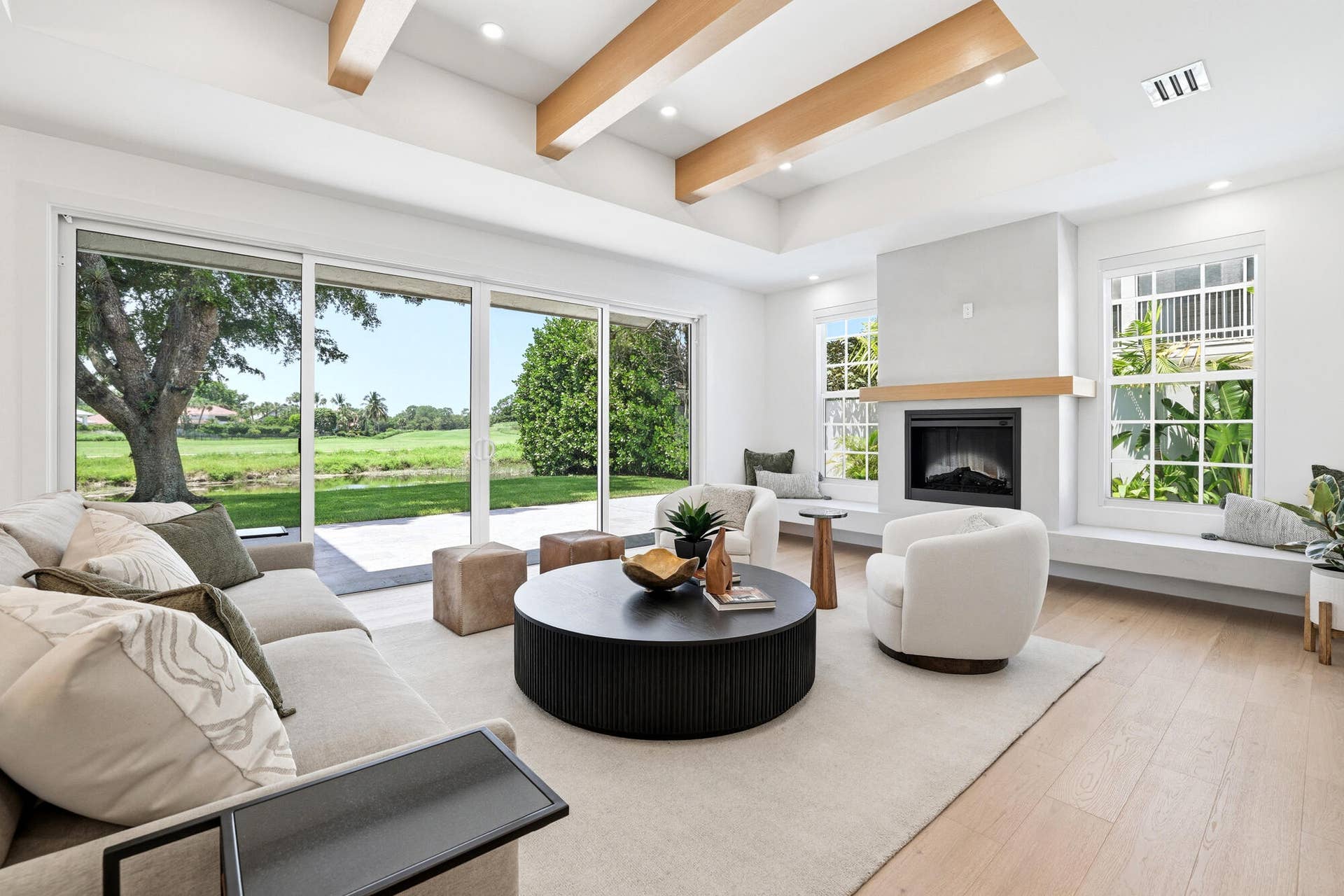 Custom beams and electric fireplace with extended bench