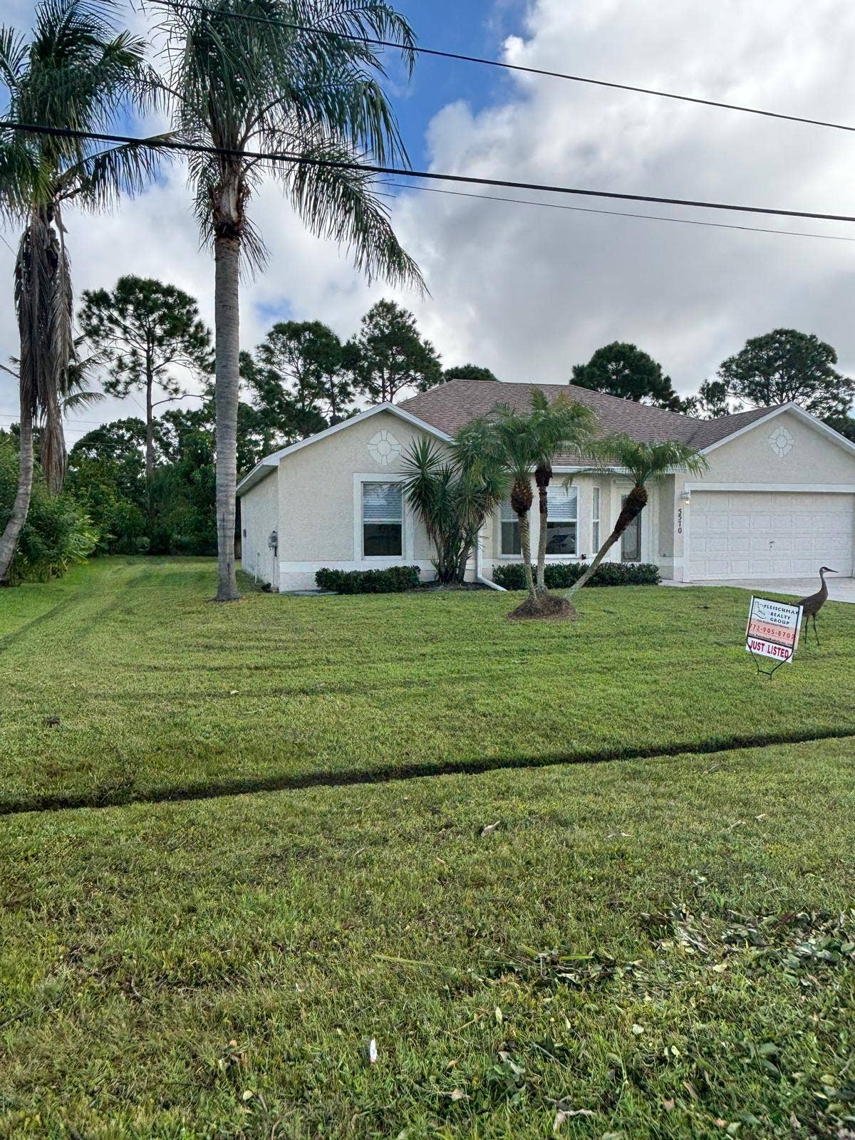 5570 NW CRUZAN Avenue, Port St Lucie, FL 34986 front left 3 wa