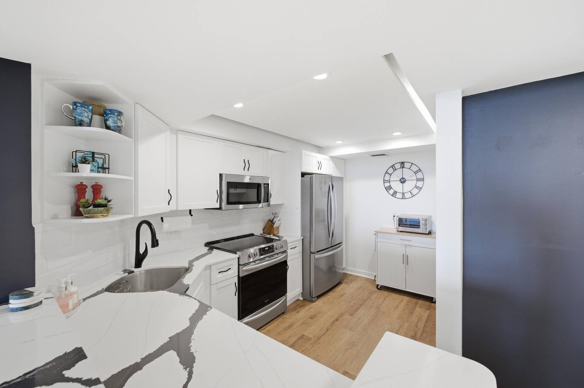 Open to Living Room with bar top with seating
