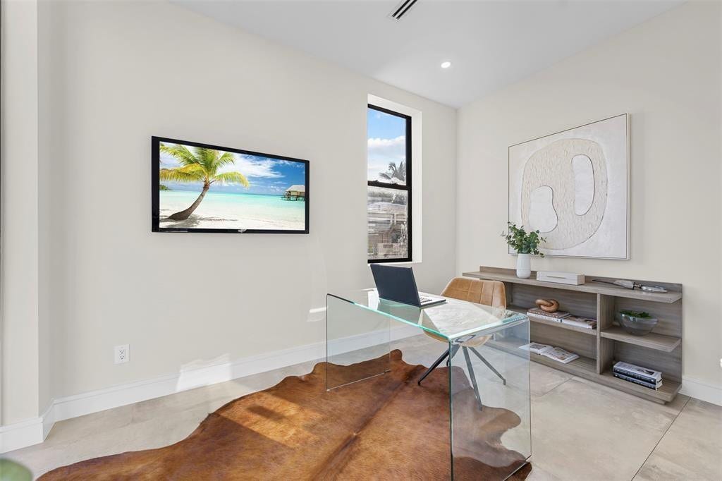 1212 AVOCADO Isle, Fort Lauderdale, Fort Lauderdale, FL 33315 Recessed lighting, window with black trim, built-in shelving unit, and light-toned walls