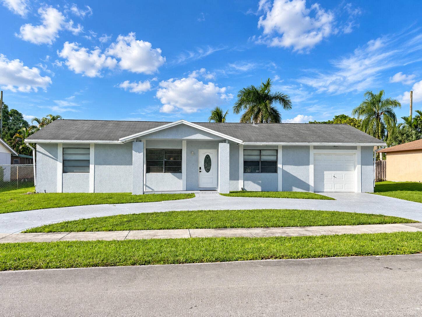12411 SW 10TH Court, Davie, FL 33325 Exterior of home. Circular driveway