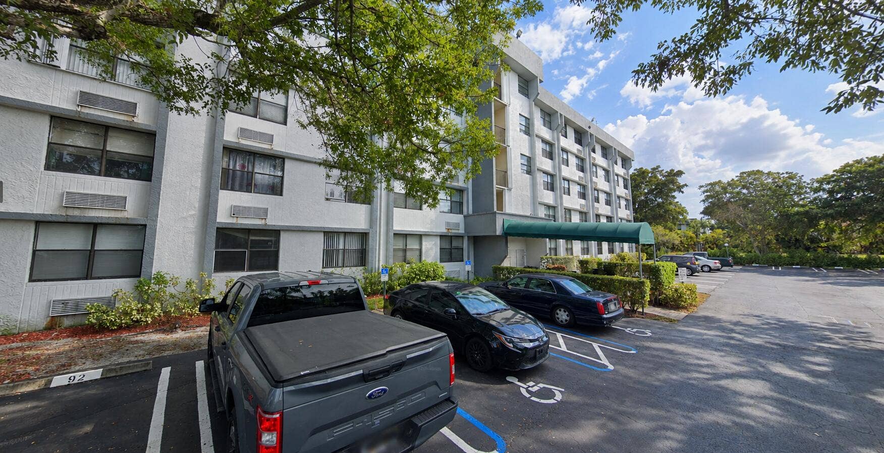 Apartment Building and Parked Cars
