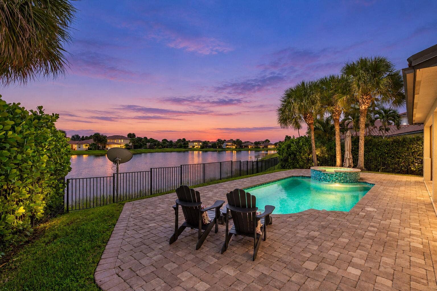 Twilight Poolside Home with Warm Lights-